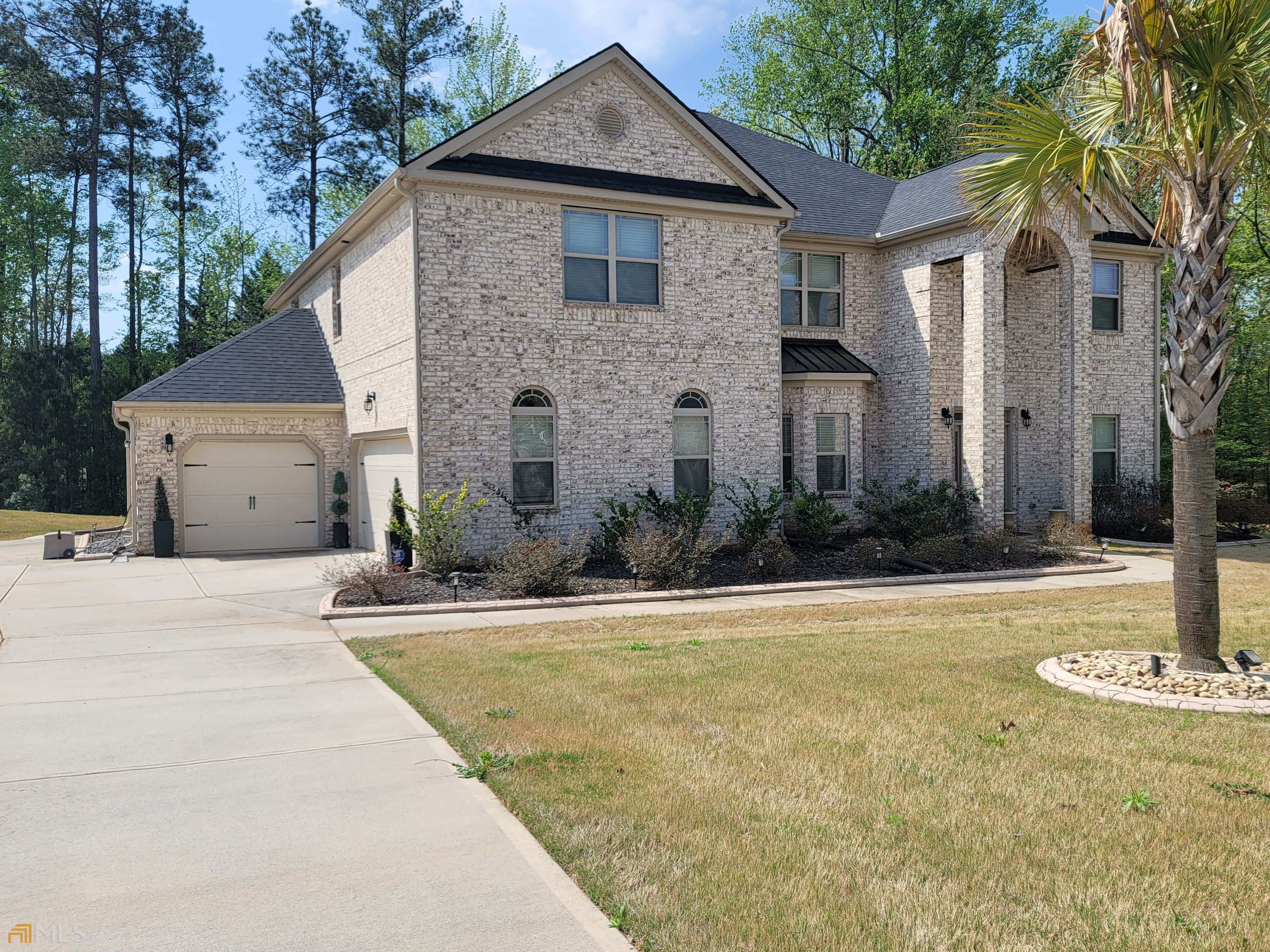 This elegant two-story home is located in the highly sought-after gated Crystal Lake community, offering a luxurious and secure living environment. Let's explore the features of this immaculate 5-bedroom, 4-bathroom residence: Main Level: The main level features beautiful hardwood floors throughout, adding a touch of elegance. Exquisite crown molding enhances the aesthetic appeal of the home. There is a formal living room and a separate dining room with a coffered ceiling and wainscoting walls, creating a sophisticated atmosphere for entertaining guests. The grand family room is highlighted by a lovely gas fireplace and a coffered ceiling, providing a cozy and inviting space for relaxation. The gourmet kitchen is a chef's dream, equipped with stainless steel appliances, spacious granite countertops, a pantry, gorgeous light fixtures, and ample cabinet space for storage and meal preparation. A bedroom on the main level offers generous space and is conveniently located near a full bathroom, making it ideal for accommodating guests. Upstairs: An upstairs loft provides an additional getaway space for any member of the family, allowing for various activities or relaxation. The owner's suite is a luxurious retreat, featuring a vaulted ceiling, a private sitting area, and a gas fireplace, creating an ambiance of tranquility and comfort. The private tiled bathroom in the owner's suite includes his and her vanities, a separate garden tub, and a walk-in shower, offering a spa-like experience. Three additional bedrooms on the upper level ensure ample space for family members or guests, and there are two additional full bathrooms that provide convenience and privacy. Outdoor Space: The enclosed patio offers a versatile area for outdoor enjoyment, whether it's for lounging, dining, or hosting gatherings. Community Amenities: The Crystal Lake community provides resort-style amenities, allowing residents to indulge in a luxurious and active lifestyle. Location: The home is conveniently located with easy access to shopping, dining, parks, and greenways, providing a well-rounded lifestyle for its residents. In summary, this 4-side brick two-story home in the desirable Crystal Lake community offers a blend of elegance, comfort, and functionality. With its impressive features, stunning finishes, and sought-after location, it provides a luxurious living experience for the discerning homeowner.
