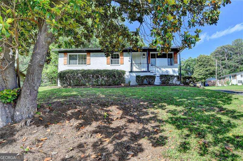 LOCATION, LOCATION, LOCATION! 20 minutes to Atlanta International Airport, 17 minutes from Mercedes-Benz Stadium! Prepare to be captivated by this fully renovated home nestled in a serene and peaceful locale. The interior has been completely remodeled, with fresh interior and exterior paint, NEW HARDWOOD flooring, new trim and baseboards, and new hardware, blending modern design with exceptional quality. Gather in the designer kitchen featuring white shaker cabinets, a spacious island with quartz countertops, a stylish tile backsplash, stainless steel appliances, and recessed lighting. The inviting open concept family room is perfect for entertaining and relaxing family time. NEW ROOF, NEW HVAC, NEW ELECTRICAL SYSTEM,