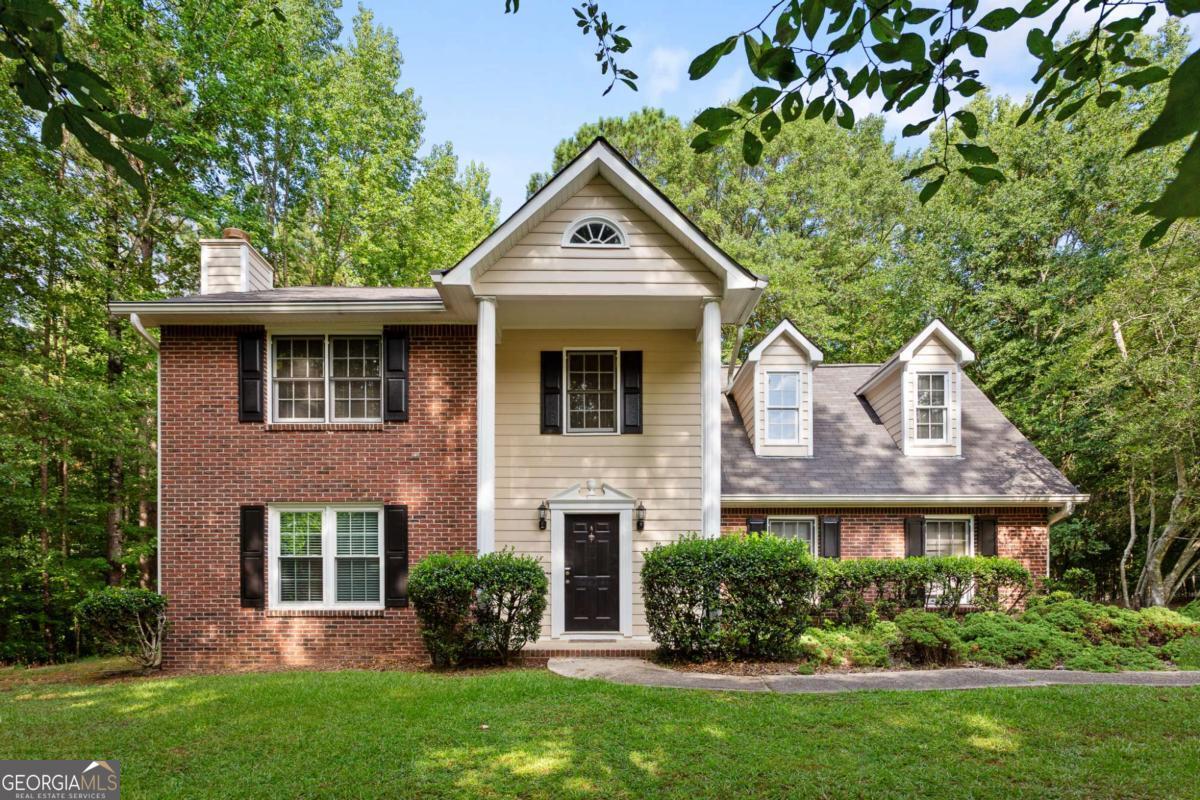 Welcome to 115 Granby Lane - A Peaceful Retreat in Windsor Estates. Nestled on a quiet cul-de-sac near the back of the sought-after Windsor Estates neighborhood, this charming 4-bedroom, 2.5-bath home offers privacy, space, and scenic views - including frequent visits from friendly neighborhood deer! Just 5 miles from historic downtown Fayetteville, this one home owner house combines natural beauty with convenience. Step inside to find updated LVP flooring in the front entry and kitchen, a formal living room and dining room, plus a bright sunroom perfect for morning coffee or afternoon relaxation. The kitchen features granite countertops, white cabinetry, and a nook for a breakfast table, ideal for both everyday meals and entertaining. A spacious 2-car garage provides extra storage options. Upstairs, the primary suite includes space for a king-sized bed, a walk-in closet, and windows overlooking the private, wooded backyard. The en suite bath features a soaking tub and separate stand-up shower. Three additional bedrooms, including a bonus room, offer flexible space for a home office, guest room, or playroom, along with a full bathroom. Don't miss your opportunity to make this inviting home your own!