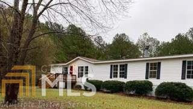 This 2,240 sq ft modular home sits on 3.08 acres on a quiet road. Spacious living room with a formal dining area. The kitchen is equipped with stove, and new refrigerator and dishwasher. New kitchen cabinets and counters. opens into family room with fireplace and built-in shelves. Large master suite consists of a bedroom with private office or nursery, and walk-in closet. The master bath has a new soaking tub separate new shower, new toilet a large double vanity. At the other end of the home, you with find the laundry room, bonus room, and two more bedrooms and bath. Bathroom boasts new tub shower combo, toilet and sink. House has fresh paint and all new laminate wood floors.