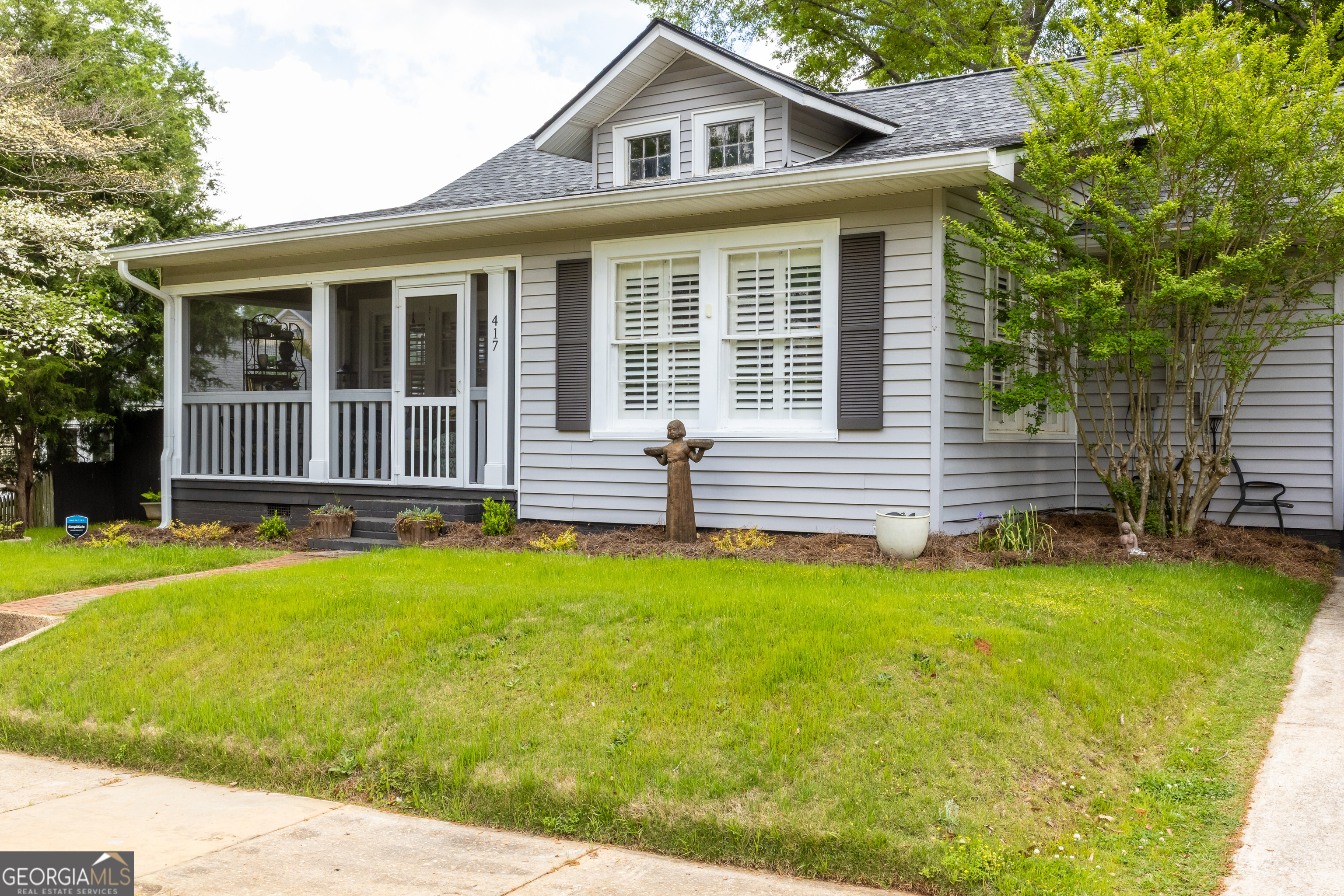 Charming, Fully Renovated Home Near Downtown Thomaston! Welcome to 417 Howell Street - a beautifully updated gem just a short walk from Upson Regional Medical Center and Thomaston's thriving downtown square. This move-in-ready home offers the perfect blend of modern updates and timeless Southern charm in a location that can't be beat. You'll love the convenience of nearby schools, shopping, and dining, all while being less than 90 minutes from Atlanta. Start your mornings or wind down your evenings on the gorgeous front porch, perfect for rocking chairs, sipping coffee, or just enjoying the peaceful neighborhood vibe. This classic Southern feature sets the tone for everything this home has to offer. Step inside to discover the best of both worlds: original hardwood floors, 1940s trim, and historic character lovingly preserved throughout, seamlessly blended with tasteful modern upgrades. The moody paint colors, bead board ceilings, and plantation blinds offer a warm, sophisticated ambiance that complements the home's timeless character and thoughtful renovation. The remodeled kitchen features new appliances, charming brick, and plenty of cabinet space, while the bathroom has been completely transformed with new tile, designer wallpaper, and stylish fixtures. Enjoy covered parking with convenient entry through a tastefully updated mudroom, ideal for everyday living. A spacious den at the back of the home offers flexibility-perfect as a second living area, home office, or an additional bedroom. The home also boasts major updates including all new electrical and plumbing, a new roof, new attic insulation, and new gutters with LeafGuard protection, giving you peace of mind and energy efficiency for years to come. Outside, escape to your own private retreat: a lush, fenced-in backyard with vibrant green grass, a cozy fire pit, and beautiful concrete patios. Unwind in the hot tub on the new custom deck or relax under the pergola-an entertainer's dream and a true backyard sanctuary. Whether you're just starting out or looking to downsize without compromising on style and comfort, 417 Howell Street is the perfect place to call home. Schedule your private showing today!