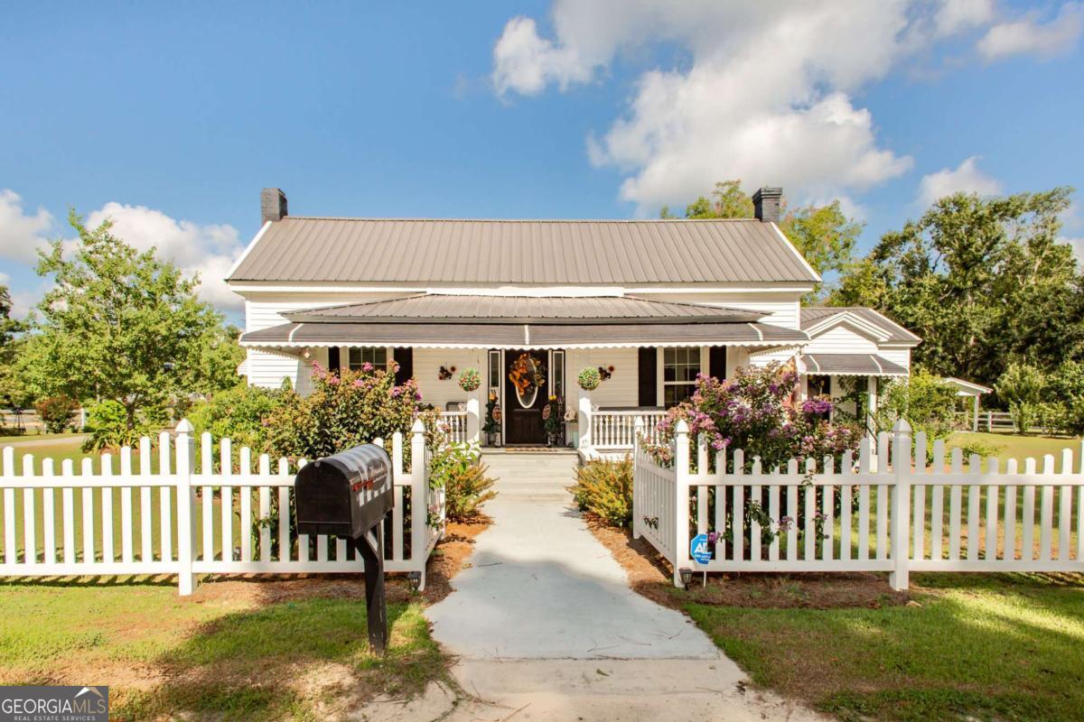 Nestled in the heart of Graham, this adorable 2-bedroom, 3-bath cottage style home sits on 1.07 acres, offering the perfect blend of small-town charm and modern convenience. With a spacious living and dining area, this 1672 sq. ft. home is filled with warmth and character. Enjoy your morning coffee on a cute little porch that comes off of the Master Bedroom, that offers a serene view of the property. Also connected to the Master is the perfect space for a home office. There is a versatile bonus space at the back of the property providing a at home spa & personal retreat for some relaxation and quiet time - or personalize it to fit your lifestyle. For those with a love for outdoor living, this property truly shines and has a outdoor entertaining area as well . Beautiful well manicured lawn that is picture perfect! 2 car detached garage and a separate outdoor storage building/shop. This home has Loads of character and many wonderful updates. City water & shallow well! Call today!