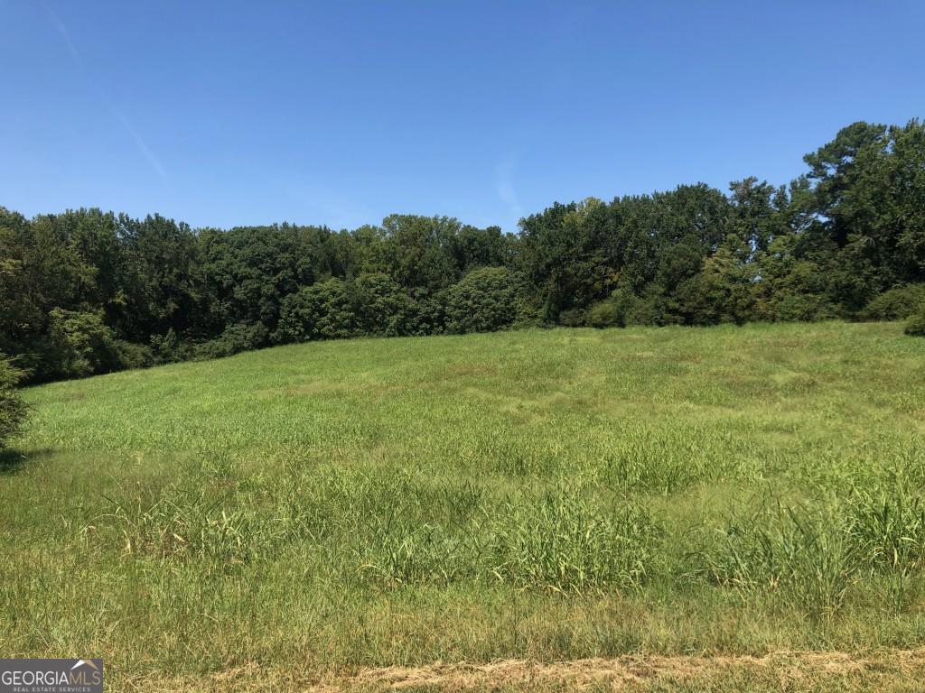 Fully cleared 6.64 Acre parcel inside Cumming City limits with access to Water, Natural Gas, High Speed Internet and gravity flow sewer within 450+/- feet. The property is currently zoned R-1. This property has development potential and has approximately 450'+/- of road frontage on Kelly Mill Road and is minutes to the new Cumming City Center, and downtown Cumming. Excellent Forsyth County Schools!