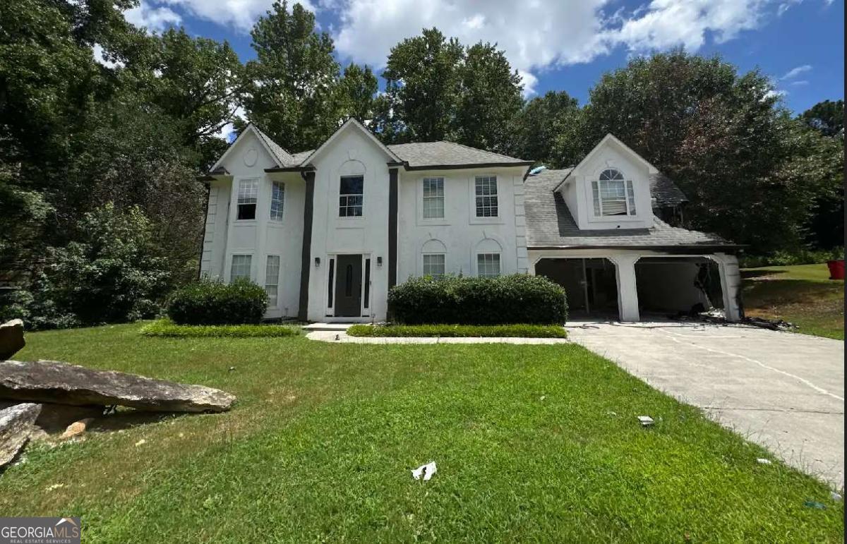 Opportunity awaits with this property located in a quiet neighborhood within a reputable school district, offering a peaceful setting with wooded views and convenient access to healthcare, shopping, dining, and entertainment, and just minutes from grocery stores, yet tucked just outside the hustle and bustle. This home was unfortunately involved in a fire and is being sold AS-IS, presenting a rare chance for the right buyer to rebuild or tear down and start fresh on a great lot. With a slab foundation, there may be potential to utilize the existing foundation, depending on buyer evaluation. The lower level experienced less damage, and whether portions are salvageable is at the discretion of the buyer. Whether you're an investor looking for your next project or a homeowner with a vision for creating a custom build in an established community, this property offers strong potential and a great location to match.