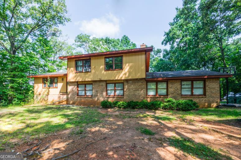 HUGE PRICE REDUCTION!! Investors dream! Great fixer upper on 2.10 beautiful acres in the sought after town of Ball Ground! Sold "as is". 3 bedrooms, 2 baths on the upper level, plus 2 bedrooms, den, 2nd kitchen & 1 full bath on the lower level. LVP flooring throughout the main level. Minutes to the quaint town of Ball Ground, shopping & schools! Minutes to Hwy 575, downtown Canton & Northside Cherokee Hospital! Great location! Cash, construction permanent, or rehab loans! Will not qualify for FHA, VA, or Conventional loans. Seller has a current appraisal. Priced well below the appraised value.