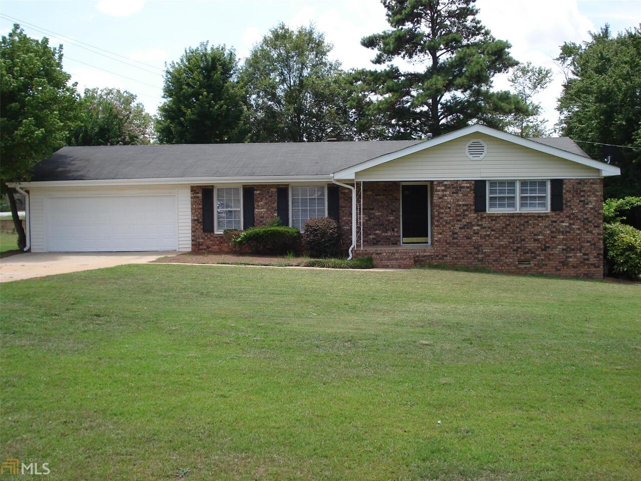REDUCED and Move in Ready! 4 Sided Brick Home on Corner Lot In Town Watkinsville with In Ground Pool! This 4 sided Brick home has been remodeled and includes all new paint and carpet throughout, New Oil Rubbed Bronze Fixtures, Tiled Bathrooms, Granite Counter Tops, Stainless Appliances in Kitchen with Tiled Backsplash, Screened Porch overlooking a Fenced Yard and In Ground Pool. If you are looking for a 1 story all brick home with in town convenience and an in ground pool in Oconee County, this is it!