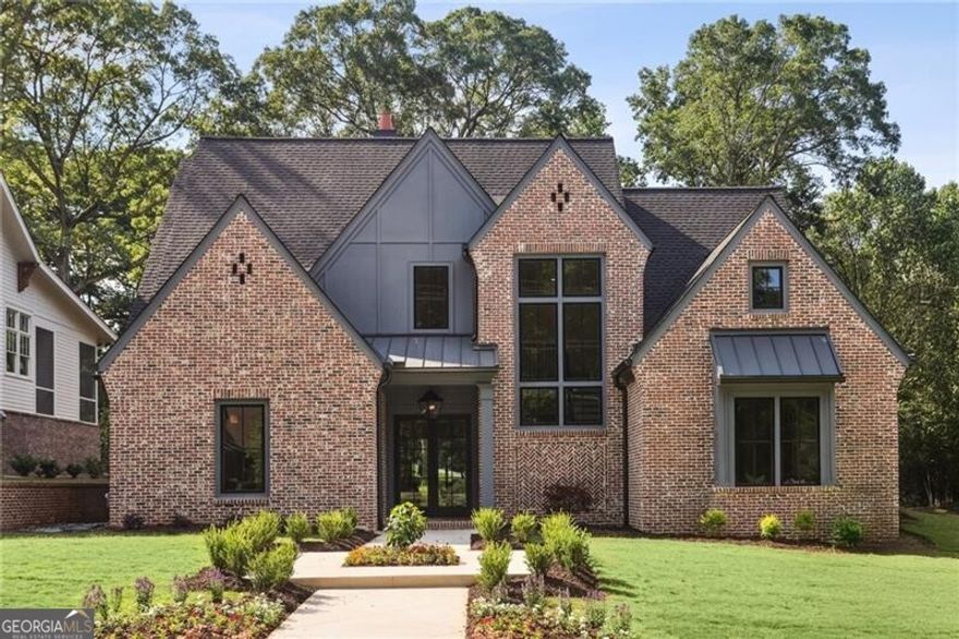 Absolutely flawless new construction near the Marietta Square, on the grounds of Marietta's oldest estate - Oakton.  5 Bedroom and 4.5 bath custom home on a beautiful flat lot, 3 car garage plus ample parking.  Designer kitchen opening directly to a living space with fireplace which, in turn, opens to a fabulous covered outdoor space with a beautiful stone fireplace.  Kitchen has full THERMADOR appliance package including a DOUBLE FRIDGE, gorgeous 48" gas range with double ovens and a custom hood vent, a pot filler, a built in dishwasher and a Kohler Fireclay farm sink.  Scullery adjacent to the kitchen with tons of storace and a prep-sink, beverage cooler and Scotsman ice maker.  Second bedroom on the main floor that could easily serve as an office and then 3 bedrooms plus a huge loft space upstairs.  A SECOND bonus space above the garage that is reached through a separate staircase (and is already plumbed for bath or kitchenette).  Builder:  KISZ CONSTRUCTIONS, Jason Kisz.  The Mountain to River Multi-Use Trails is right there along Kennesaw Avenue.  Turn left and it's a quick trip down to Kennesaw Mountain National Battlefield Park.  Turn right and the path leads directly to the Marietta Square and all the amazing restaurants, theaters and museums there.