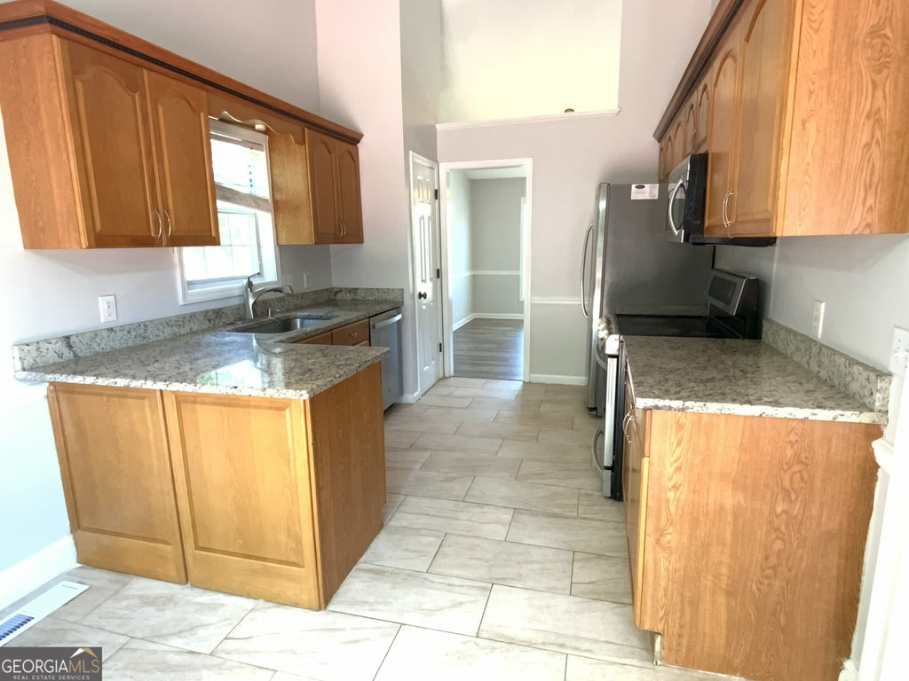 Photo of 5600 Sugar Crossing Drive, Sugar Hill, GA 30518 (MLS # 10777827)