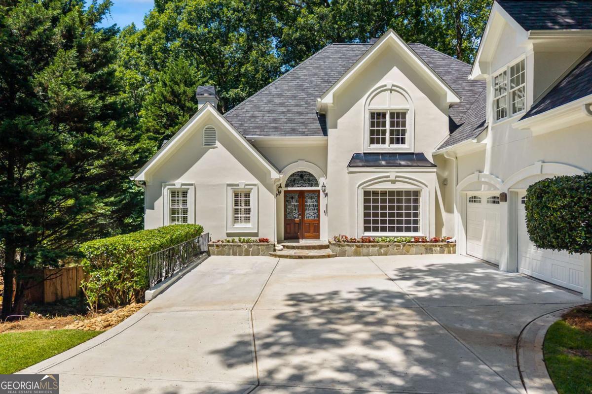 Tucked away on a quiet cul-de-sac in Roswell's sought-after Hadfield swim/tennis community, this beautiful and spacious home is the total package! Large square footage for the neighborhood with the master on main, a fully finished terrace level with a bed/bath, and a large, flat backyard perfect for kiddos to play with the option to add a pool! This home is an entertainer's dream and a personal retreat all in one. Inside, you'll find soaring ceilings, tons of natural light throughout, charming trim work throughout, a freshly painted interior, separate dining, two living rooms both with their own fireplace, and a spacious main-level primary suite with a walk-in closet, separate his/her vanities, a beautiful soaking tub by the fire, and private access to the expansive rear deck. The main floor also includes a half bath, hardwood flooring, and recessed lighting. The finished terrace level is ideal for multigenerational living, private office, or hosting out-of-town guests with a bed and bath, lots of additional storage, workshop, plus private access to the backyard oasis. Located within one of Roswell's top-rated school districts and just minutes from Brookfield Country Club and Downtown Roswell. Schedule your showing today and make this home your own!