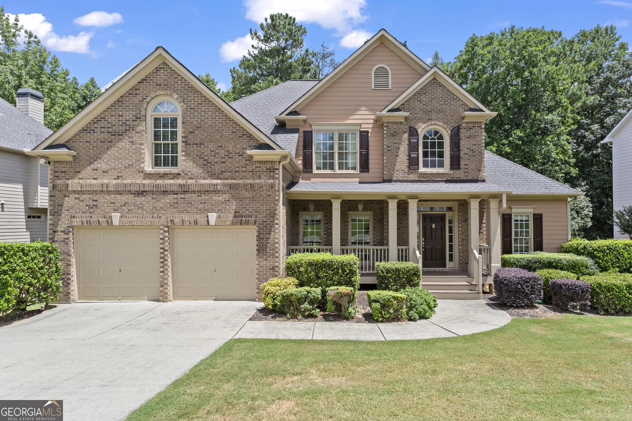 Location! Location! This impressive and spacious 6-bedroom, 4-bath home offers over 4,000 square feet of versatile living space-(Tax records do not reflect finished basement sq ft)-perfect for large households or multi-generational living. Conveniently located just minutes from Downtown Woodstock, top-rated schools, major highways, and more. This well-kept home features a master on the main level, as well as a guest suite with a separate full bath. The dramatic two-story foyer and soaring great room with a gas fireplace, Palladian windows, and casement windows throughout flood the home with natural light. The updated kitchen includes new stainless steel appliances with an easy-to-clean smooth cooktop, granite countertops, and a breakfast bar. The eat-in kitchen, with its cathedral ceiling, overlooks the private, partially wooded backyard and offers access to the oversized deck. The primary bedroom also has deck access, a light-filled walk-in closet, and a well-appointed en-suite bathroom with double vanities. Upstairs, you'll find three spacious bedrooms, including a bonus room/bedroom with a closet and additional storage space, as well as a Jack-and-Jill bathroom. The fully finished, daylight walk-out basement features a large flex space, bedroom, oversized full bath, office, custom built-ins, generous storage, and room to expand. A space originally designed as a sound booth can easily be converted into a mini kitchen or bar. The basement opens to a covered terrace-level patio-an ideal setup for entertaining or a future in-law suite. Come see why Arbor View is one of the best neighborhoods in Woodstock, and explore the newly updated first-class amenities, including swim/tennis, nature trails, playgrounds, and more!