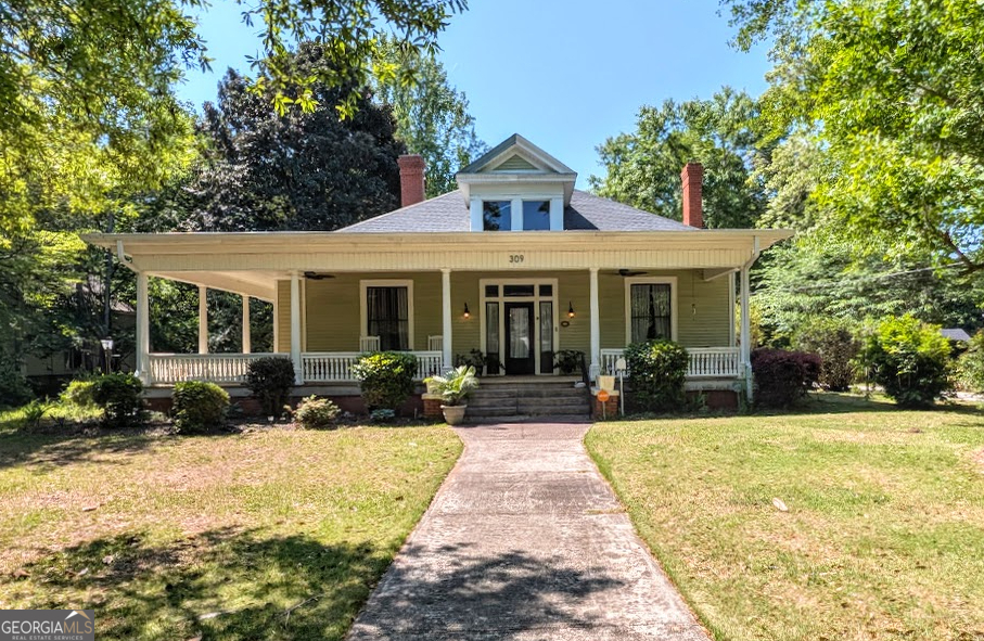 Beautifully restored 1914 Craftsman Bungalow in the Everett Square Historic District. Over 2,500 sq ft on more than 1 acre with soaring ceilings, transom doors, and abundant natural light. Recent updates include roof, HVAC, updated electrical, and renovated bathrooms. Spacious unfinished attic with stair access offers potential for additional living space. Exterior features include a wide wraparound porch, detached garage, workshop, and multiple storage buildings surrounded by mature trees and established landscaping. More pics coming soon.
