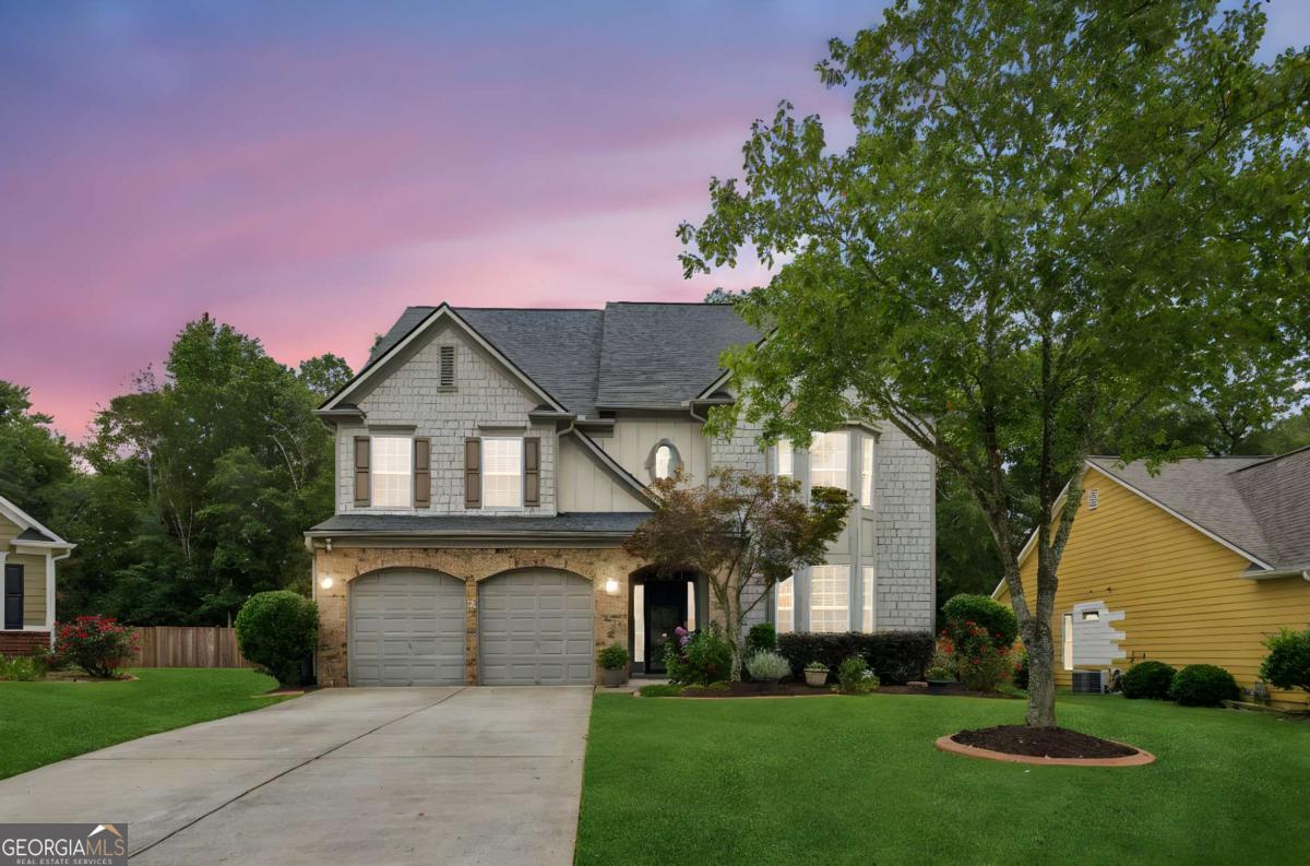 Are you looking for a house with room for everyone in the perfect neighborhood setting? This expansive, 7 bedroom home boasts an open and comfortable layout, filled with natural light and timeless finishes. Walk through the front door into the grand foyer currently being used as an oversized dining room with the potential to serve many purposes! The formal dining room flows through to the kitchen which overlooks the family room. The climate-controlled sunroom is perfect for effortlessly entertaining your guests with the addition of a stylish dry bar. Attached to the sunroom is a screened porch area with a hot tub ready to help you relax as you overlook your private, fenced back yard! Finish off the first floor with a bedroom and full bathroom making this a multi-generational home. The primary suite is located on the second floor along with 3 other bedrooms and a shared bathroom. Head to the third floor and find the perfect flex space next to two more bedrooms with shared bathroom. Along with the sunroom addition in 2018, the home was further enhanced with a new roof, a 50-gallon hot water heater with expansion tank, French drains, and a full sprinkler system-providing peace of mind and convenience for years to come. Set in one of Forsyth County's most desirable school districts with easy access to top-rated schools, all located within a 3-mile radius, makes daily routines seamless. With its combination of modern updates, outdoor living features, and access to the best of what Forsyth County has to offer, this home is a MUST SEE! This desirable floorplan hasn't been on the market since 2022 AND is priced lower per square foot, so now is the time to make a move! *Ask about our American Frontline Rewards Program serving Active/Retired Military, First Responders, Hospital Workers & School Employees!*