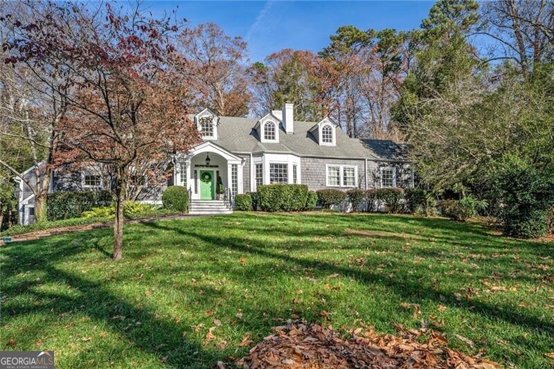 Timeless Cape Cod retreat on a private Buckhead lot with endless potential. Nestled on a stunning 1.08 acre estate property, this 1940s residence blends classic charm with impressive scale and opportunity. A shingle-style exterior opens into a vaulted foyer and a sweeping 25-foot living room filled with natural light. The adjacent study/library features soaring ceilings, a fireplace, and custom bookcases, connecting seamlessly to the serene primary suite. The primary suite includes an additional flex room with its own private bath, perfect for an office, fitness space, or guest accommodations. Two additional bedrooms complete the main level, joined by a Jack-and-Jill bath.Newer kitchen addition with a vaulted breakfast room, is designed for both intimate dinners and larger gatherings. French doors lead to a walk-out backyard with a covered veranda and outdoor fireplace, open green space, a large play yard, and a charming cabin from the 1800's! A former pool has been filled in but could easily be restored, creating even more possibilities for outdoor living and entertaining.The 2,500-square-foot terrace level adds valuable living space, with 1,000 square feet already finished, featuring hardwood floors, daylight windows, walk-out access, a bedroom with full bath, and a spacious playroom. The remaining area provides generous unfinished square footage, ready to be customized to fit future needs.With significant structural renovations completed in 2017, this home is ready for thoughtful updates to reach its full potential, combining timeless character, versatile living, and a premier Buckhead location. Agent is owner. Offering 2/1 buydown assuming Jumbo conventional 30 year fixed at 6.75 rate. Seller is also offering $20k closing cost incentive. Total of incentives shall total $50k.