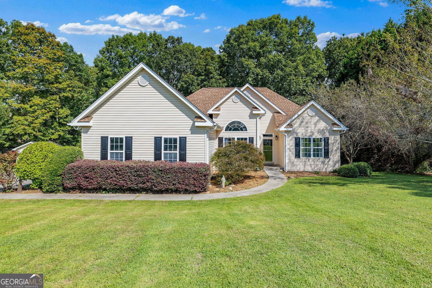 Beautifully updated 3 bed/2 bath home on 1.1 acres in an established Gainesville neighborhood. Light, bright kitchen with granite countertops, stainless steel appliances, and plenty of cabinet space. Luxury vinyl plank flooring throughout great room, dining, kitchen, and baths. Spacious primary suite and updated baths with granite. Rear deck with hot tub overlooks large, level, fenced backyard-perfect for entertaining, kids, or pets. Mature trees and landscaped curb appeal enhance this well-maintained property. Move-in ready and conveniently located near shopping, dining, schools, and Lake Lanier.