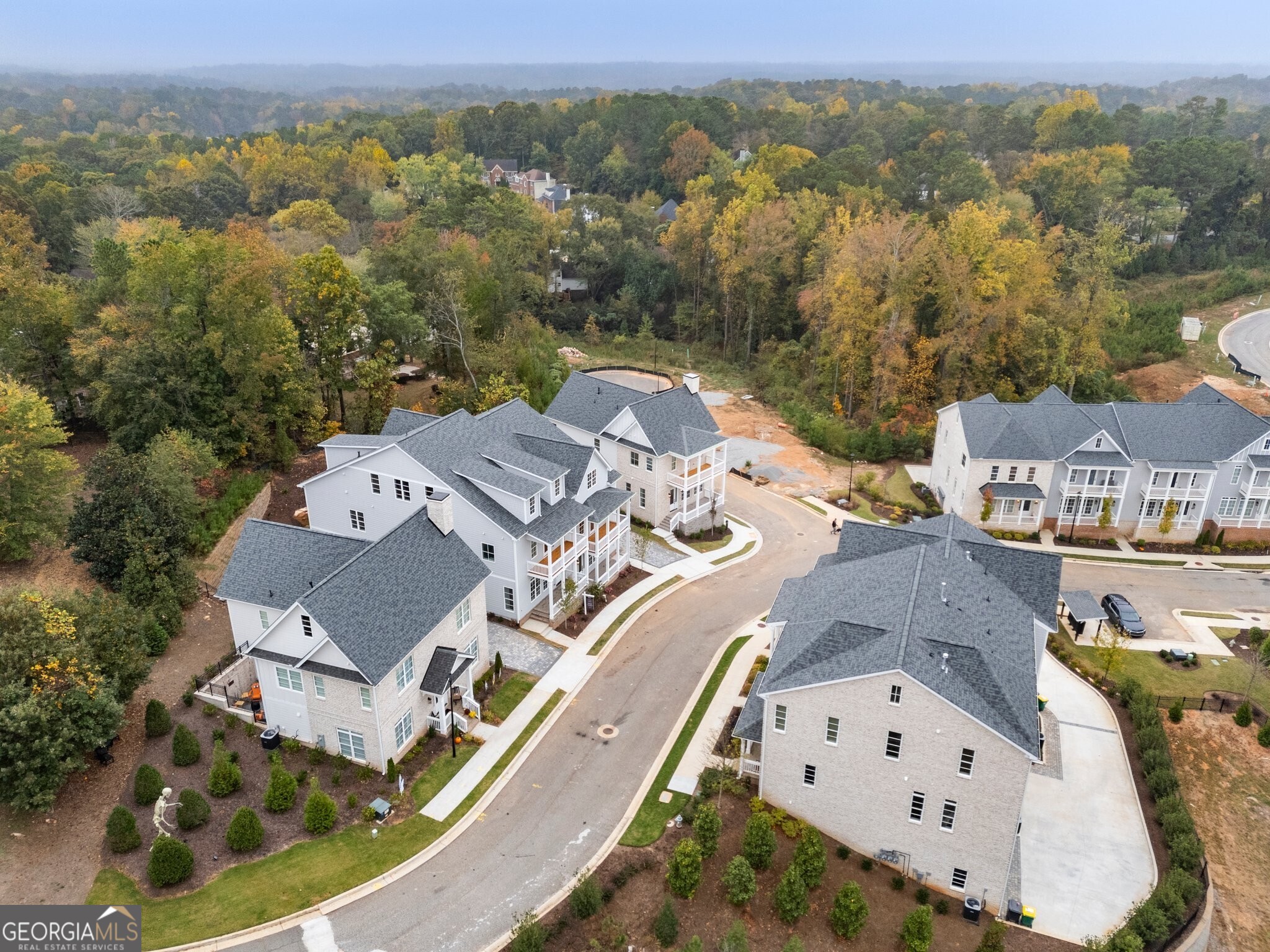 Welcome to Parkside Roswell, a stunning new construction community ideally situated across from East Roswell Park-a 40-acre haven offering walking trails, tennis courts, sports fields, a dog park, playgrounds, a frisbee golf course, and more. The community features a mix of thoughtfully designed townhomes and single-family residences conveniently located in Roswell near Johns Creek and Peachtree Corners to enjoy numerous options for shopping, dining, and parks including the Chattahoochee River. Enjoy the perfect blend of comfort, convenience, and outdoor living. The interior of this brand new single family home has been thoughtfully designed for modern living with the 10' ceilings, wide-plank hardwood flooring and an open floor plan. The great room flows seamlessly into the kitchen and dining spaces, allowing for everyday convenience and effortless entertaining. The kitchen features custom white shaker cabinetry with soft-close doors and drawers, quartz countertops with a 9' waterfall island, stainless steel appliances and walk-in pantry. Off the kitchen is a spacious deck with a woods view. The living area is centered around a fireplace framed by a herringbone porcelain tile inlay and floating wood mantle. Upstairs, the primary suite boasts a spacious ensuite with dual vanities with marble countertops, a freestanding soaking tub, frameless shower and dual walk-in closets. The private covered balcony off the primary suite expands the living space outdoors to enjoy your morning cup of coffee or as an evening retreat. An additional 2 bedrooms, full bathroom with dual vanities and laundry room complete the top floor. Downstairs, the terrace level boasts 12' ceilings and a full bedroom and ensuite bathroom that makes for an ideal private guest retreat. An additional versatile space on the lower level offers endless possibilities as a recreation space/game room, home office or study, or even a home gym. A mudroom/drop zone off the 2-car garage offers everyday convenience and practicality. Crafted by a professional design team, each residence offers designer-curated selections perfectly blending style and practicality for everyday living. This beautiful home is currently under construction with expected delivery Summer 2025. Contact us today to schedule your on-site visit and be one of the first to learn more about this exceptional home and builder incentives that may apply. *Images are of similar builder product and floorplan. See lookbook images for finishes, features, and floorplan for this home.