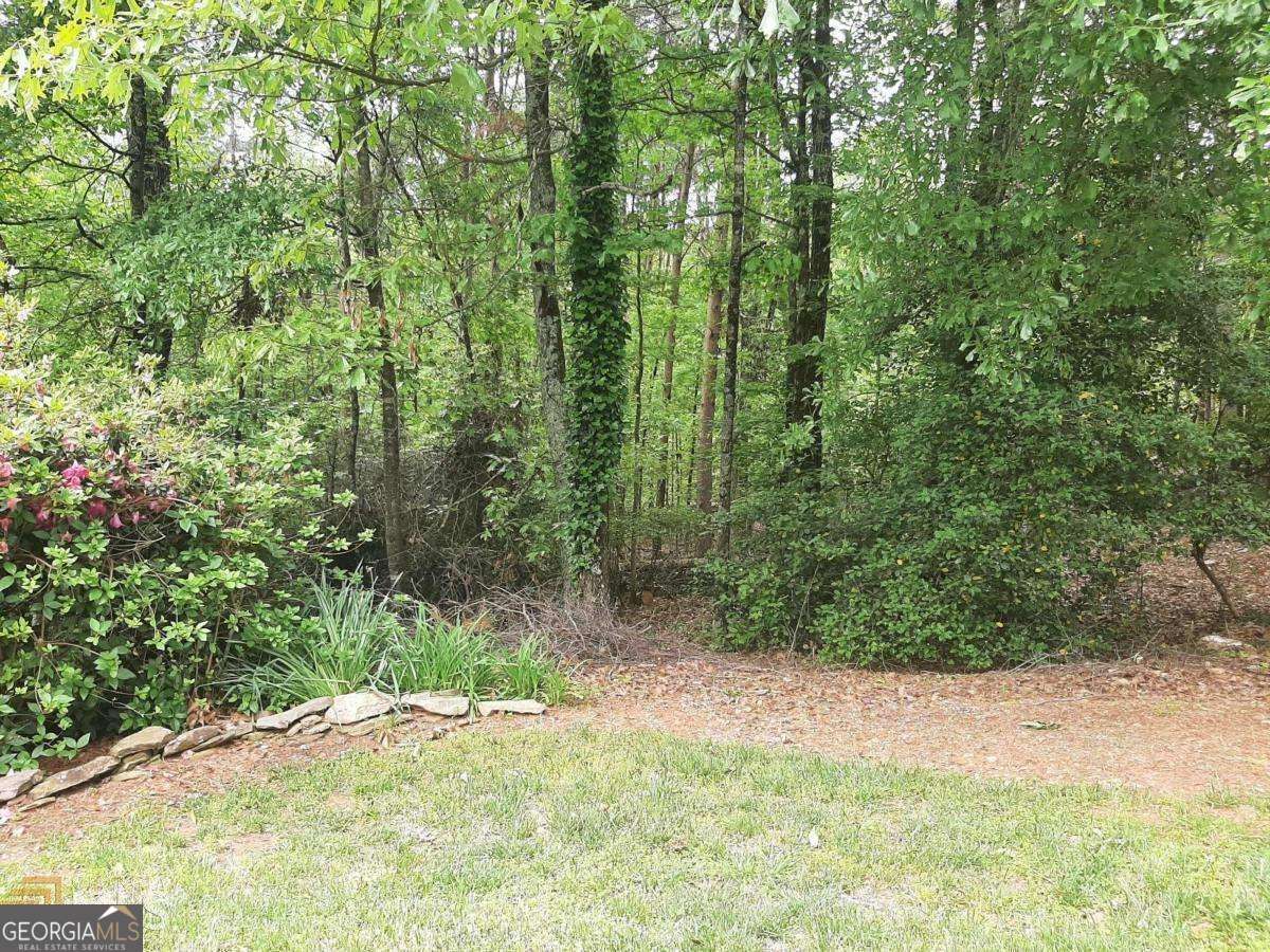 Lovely .86 acre single family residential lot in Point Olympus, a lake point community in the city. Point Olympus is a small quiet neighborhood just off Thompson Bridge Rd. Features gentle rolling topography and mostly hardwoods. Great lot for homes on a terrace level. All utilities are available (except sewer) and have not been cleared or have soil tests. Lot 16 is first lot as you turn onto Point Olympus.