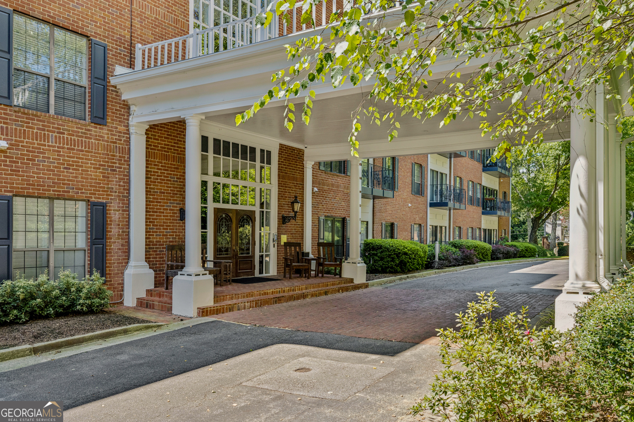 This charming condo is located within the gorgeous, gated community of The Richmond, which is situated in the heart of Buckhead. The stunning first-floor unit offers two bedrooms and two full bathrooms. As you walk in the door, you'll be greeted by hardwood floors that flow seamlessly throughout the main living area. Natural light pours into the living room through expansive sliding glass doors, creating a bright and inviting atmosphere. As you pass through the living room, you'll notice a gas fireplace. Continue straight ahead to reach the well-lit sunroom that can be used in many ways, such as an office or sitting area. From the sunroom, you can access your own personal balcony that has a beautiful view of the pool. The kitchen features stainless steel appliances, a breakfast bar, granite countertops, white cabinets, and connects effortlessly to the open-concept dining and living room areas. This home has a roommate floor plan, with two oversized bedrooms. The primary bedroom has his-and-her closets, and an ensuite primary bathroom that features dual vanities and a combined shower and tub. The secondary bedroom also has an ensuite bathroom with a combined shower and tub. It also contains a laundry that is fully equipped with a washer and dryer. Additional features of this unit are two assigned parking spaces and new paint throughout. The highly sought after Richmond community offers fantastic amenities, including concierge services, a pool, fitness center, business center, clubhouse, and covered parking. It is located within walking distance to fantastic restaurants including Sushi Kiku, Roasters, Toast on Lenox, and Toast Noir Cafe. It is a short drive to some of Atlanta's best shopping, such as Phipps Plaza and Lenox Mall. It is also just a few minutes away from I-285 and GA-400.