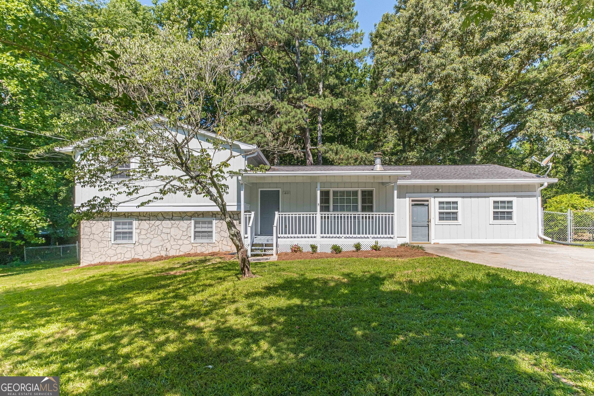 Welcome to the heart of Snellville, Georgia, where this magnificent tri-level home awaits its lucky new owners! Situated on a large level fenced lot, this property boasts not only a convenient location but also an array of desirable features. With three bedrooms and three full baths, this home offers spaciousness and comfort for the whole family. Upon entering, you'll be greeted by the inviting atmosphere of the main level, which features two flexible spaces that can be tailored to your specific needs. Whether you envision a home office, a cozy reading nook, or an entertainment area, these versatile rooms provide endless possibilities to suit your lifestyle.The lower level of this home offers an additional two flex spaces, ideal for a home gym, playroom, or even a guest suite. You'll appreciate the flexibility of these rooms, allowing you to adapt the space to your changing needs and preferences.One of the highlights of this remarkable home is the sunroom, a tranquil oasis that lets you bask in natural light while enjoying the serene views of the surrounding landscape. This space serves as a perfect retreat for relaxation, morning coffees, or afternoon gatherings with friends and family. The fenced yard provides ample space to run and romp with an added feature - a half basketball court for hours of fun. Step inside and notice the fresh interior and exterior paint, exuding a modern and stylish ambiance throughout the home. Complementing this aesthetic are the luxurious and durable LVP (Luxury Vinyl Plank) flooring and tile floors, which provide both elegance and ease of maintenance. Furthermore, the main portion of this property features a brand-new HVAC system that carries a 10 year manufacturers warranty and the addition has a separate HVAC system, ensuring optimal comfort and energy efficiency year-round. Say goodbye to sweltering summers and chilly winters; this home is designed to keep you comfortable no matter the season. Located in the heart of Snellville, you'll enjoy the convenience of nearby amenities, including shopping centers, restaurants, and parks. This sought-after community offers a peaceful neighborhood setting while being just a short distance from major highways, making commuting a breeze. Don't miss out on the opportunity to make this tri-level gem your own. Schedule a showing today and experience the charm and potential this home has to offer.