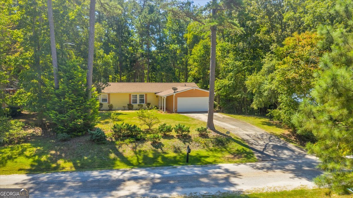 COMING SOON! Welcome to this well-loved home in the desirable Turtle Cove community. Offering three bedrooms, two bathrooms, and 1,525 square feet, this ranch home blends comfort with lifestyle amenities that make it stand out. Inside, you'll find an inviting living space with French doors that open to the back deck, ideal for weekend cookouts. The eat-in kitchen flows easily into a dedicated dining area, creating a warm setting for meals and gatherings. Both the roof and HVAC have been updated in recent years, with the roof approximately four years old and the HVAC approximately three years old. Turtle Cove residents enjoy access to a nine-hole executive golf course, five white sand beaches with four boat ramps, a swimming pool, pickleball and tennis courts, and a clubhouse featuring a dining room, lounge, and year-round events. Parks and playgrounds throughout the neighborhood make golf carts the preferred mode of travel. This Monticello property offers the perfect mix of a welcoming home and an active community lifestyle, all just minutes from Lake Jackson.