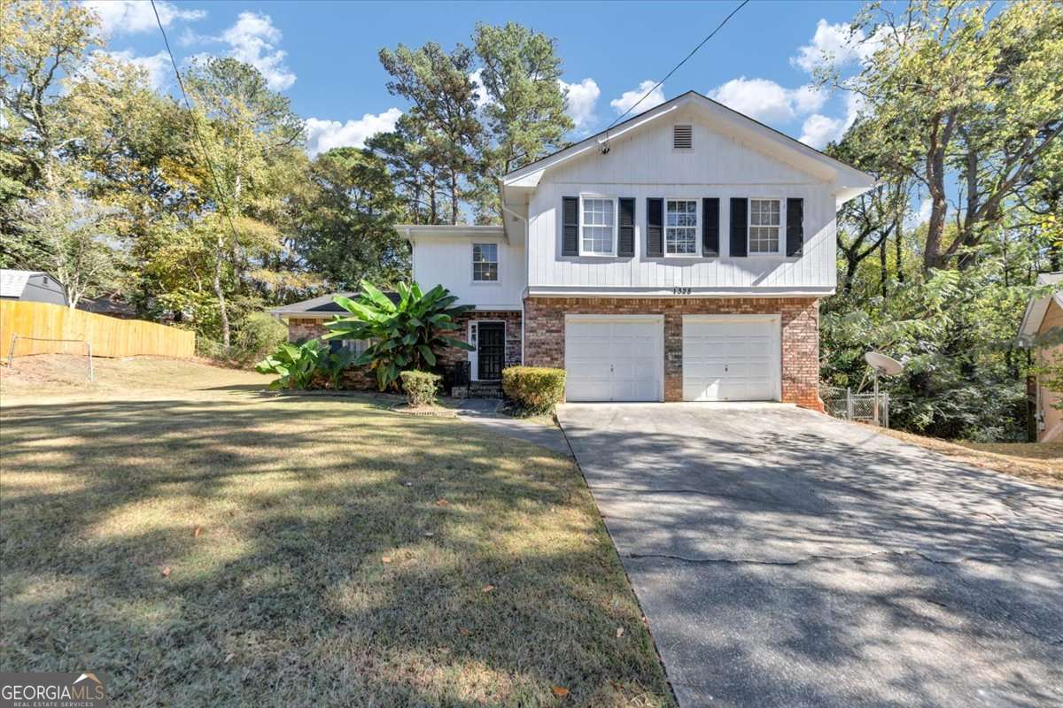 A spacious 4-bedroom, 2.5-bath home with a versatile bonus room - ideal for a home office, game room, guest space, or creative studio. Tucked away in a picturesque cul-de-sac in Decatur, this home offers plenty of room to grow, work, and unwind. Inside, you'll find a bright living area, an eat-in kitchen, and a comfortable primary suite with an en-suite bath. Out back, enjoy a private deck that's perfect for grilling, entertaining, or just relaxing. Conveniently located near I-285, shops, schools, and more - this home is full of potential and ready for your personal touch.