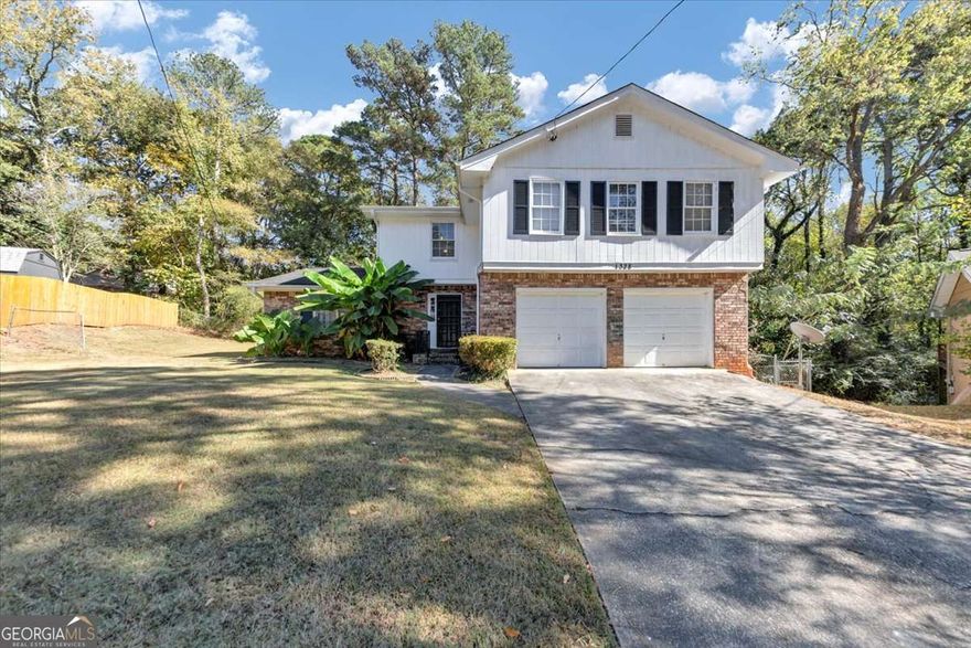 A spacious 4-bedroom, 2.5-bath home with a versatile bonus room - ideal for a home office, game room, guest space, or creative studio. Tucked away in a picturesque cul-de-sac in Decatur, this home offers plenty of room to grow, work, and unwind. Inside, you'll find a bright living area, an eat-in kitchen, and a comfortable primary suite with an en-suite bath.    Out back, enjoy a private deck that's perfect for grilling, entertaining, or just relaxing. Conveniently located near I-285, shops, schools, and more - this home is full of potential and ready for your personal touch.