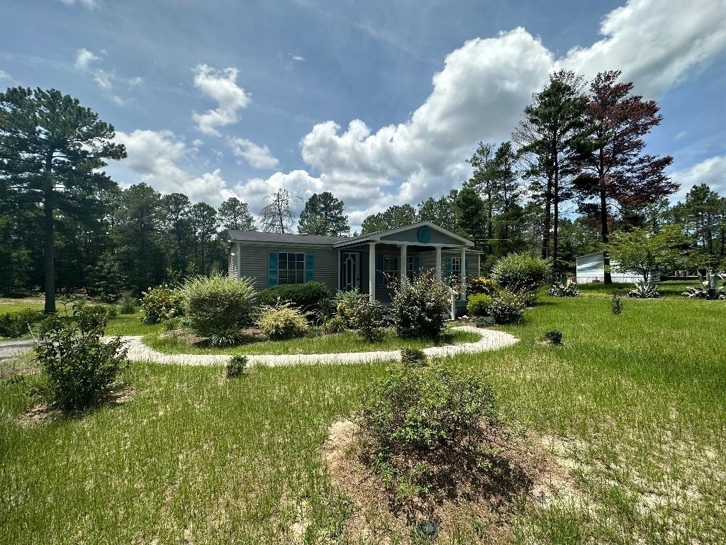 This 3 bedroom 2 bath manufactured home sits on 1.32 serene, peaceful acres. The property is a handyman's special with tons of potential and is being sold as-is. The property is just waiting for its new owner to fix it up to your liking.