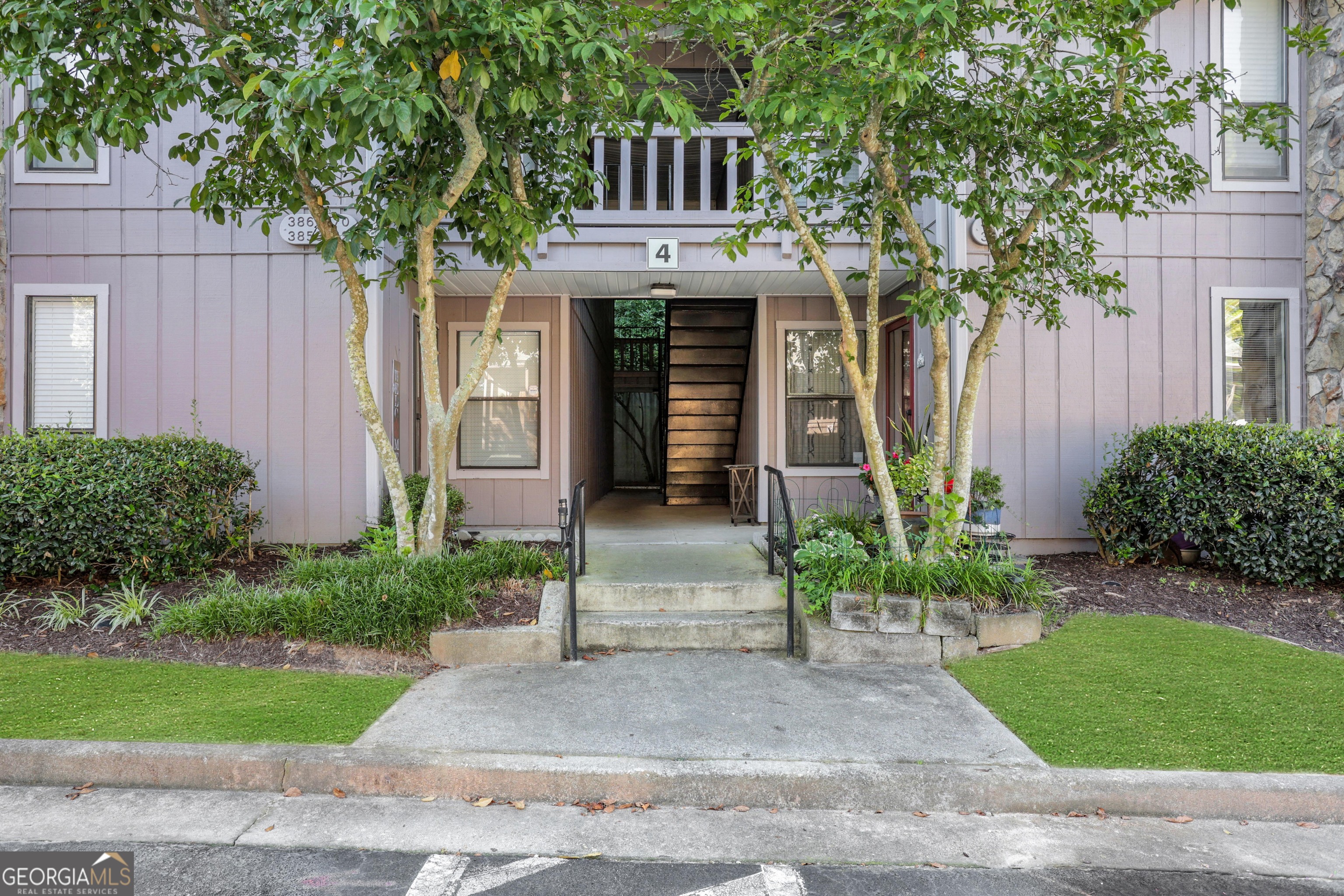 Welcome to easy living in the heart of Tucker! This beautifully updated garden-level condo in the gated Woodridge community offers the perfect blend of comfort and convenience. Featuring 2 bedrooms and 2 full baths, the home has been thoughtfully renovated throughout, just bring your furniture and move right in. The spacious floor plan includes an open-concept living and dining area, a modern kitchen with stainless steel appliances, and a cozy sunroom that's ideal for relaxing, working from home, or entertaining guests. The garden-level entry provides stair-free access, perfect for anyone looking for one-level living. Enjoy low-maintenance living with exterior upkeep, water, and trash all included in the HOA. The Woodridge community is known for its peaceful, park-like setting and offers residents access to a pool and clubhouse. With easy access to I-285, Northlake shopping, Emory, CDC, and downtown Tucker, this location checks all the boxes. Whether you're downsizing, buying your first home, or looking for a low-maintenance lifestyle, this turn-key condo is a must-see!