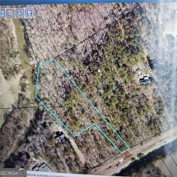 Build Your Dream on 2.5 Acres! This level, 2.5-acre lot is primed and ready for your vision, saving you valuable time and money. All permits are in place (except the building permit), plus the water meter, electric transformer box, and driveway are already marked on site. Building plans and blueprints are available to the buyer, making it even easier to bring your dream home to life. Enjoy the peaceful setting with a creek at the rear of the property. Skip the long wait for approvals, the hard work is already done. Now it's your turn to design and create your ideal home in this serene environment.