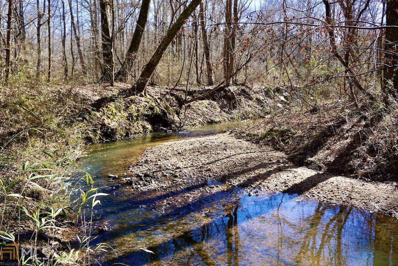 This 29.5 +/- acre tract is located along the gravel corridors of Old Four Notch Rd just a few miles east of Carrollton, Georgia. The property features an incredible potential homesite atop one of the upland hardwood ridges. Build your dream house with views usually only seen in the mountains. Whopping Creek flows through the property providing a very serene setting for you to enjoy. The property is less than 7 miles from the downtown square and 8.5 miles from the University of West Georgia campus. Many have claimed this gravel road stretch is one of the prettiest roads in Carroll County. Pictures do not do this beautiful tract justice.