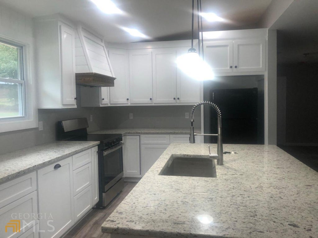 Photo of 4310 Bouldercrest Road, Ellenwood, GA 30294 (MLS # 10839793)