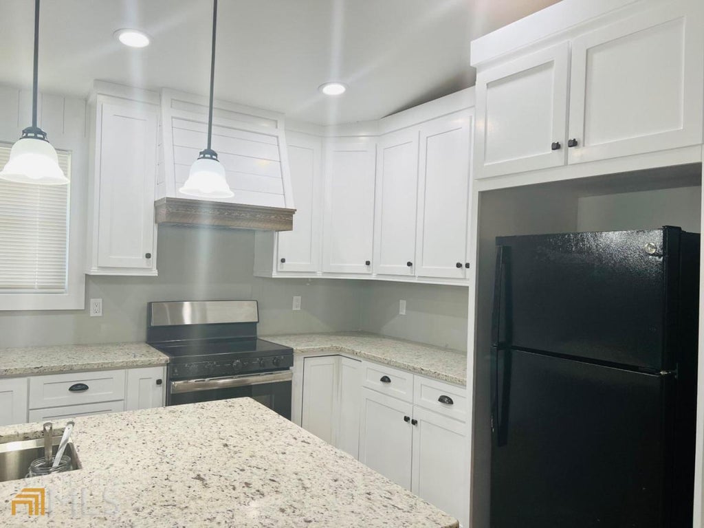 Photo of 4310 Bouldercrest Road, Ellenwood, GA 30294 (MLS # 10839793)