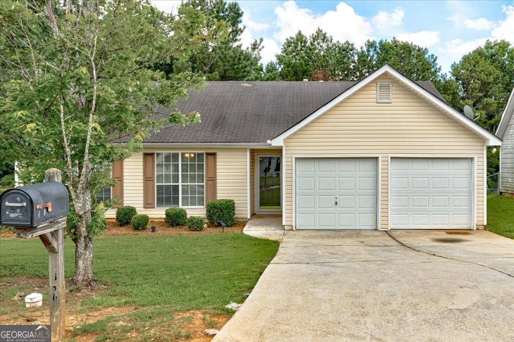 The sweetest soft yellow ranch-move-in ready and full of charm! Nestled in the desirable Cedar Trace community with no HOA dues, this adorable ranch-style home is the perfect place to settle in. Step inside to a spacious living area complete with a cozy fireplace, ideal for relaxing or entertaining. The kitchen offers plenty of storage and a cheerful eat-in dining nook. The primary bedroom is generously sized with a private bath and a walk-in closet. Two additional bedrooms offer great space for guests, family, or a home office. Sitting on a level lot with plenty of yard to enjoy, this home checks all the boxes. Don't miss your chance to make it yours!