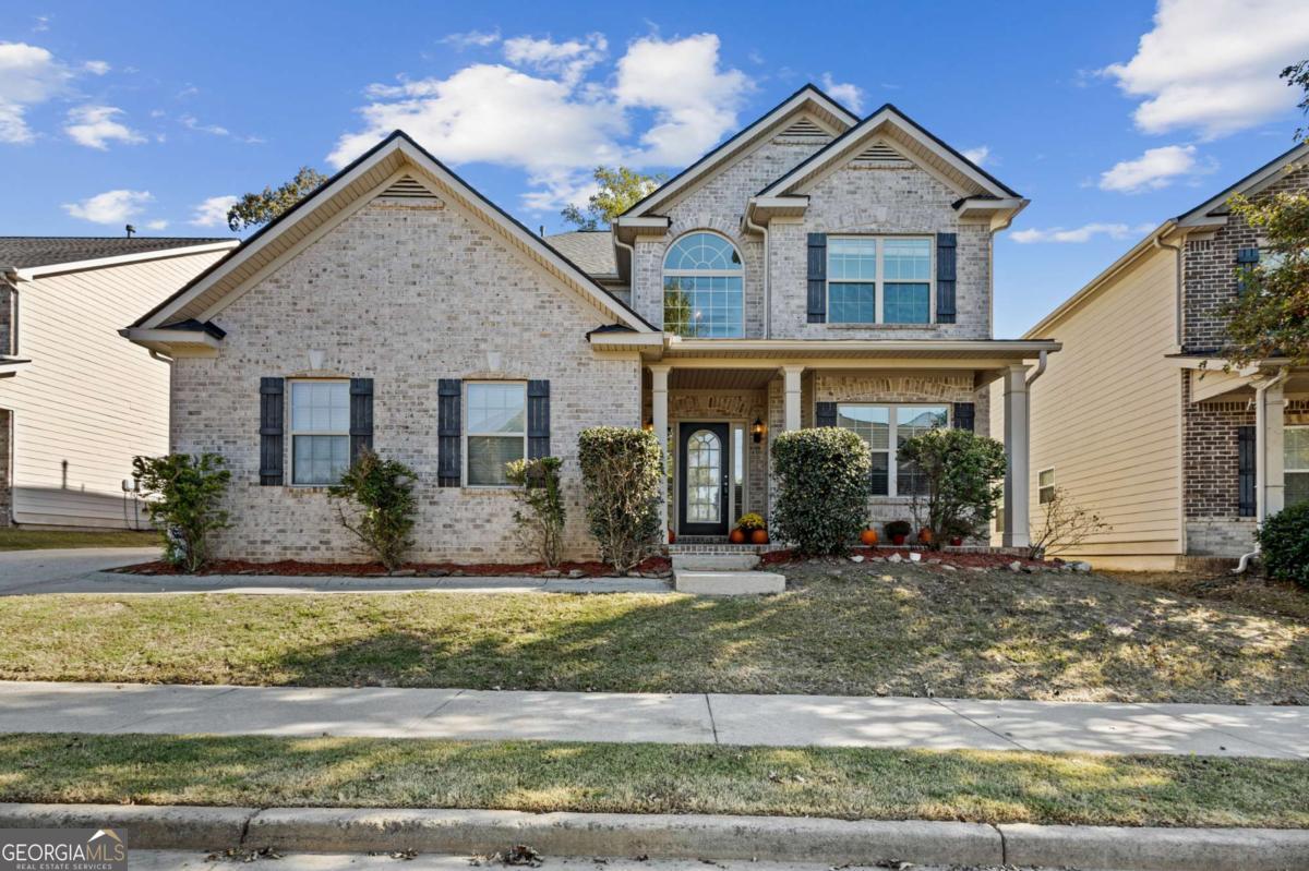Welcome to this stunning 5-bedroom, 3.5-bath traditional home in the sought-after Cherokee County School District in the heart of Canton, GA. Step through the two-story foyer and into a home that blends elegance and warmth with timeless charm. Hardwood floors flow throughout most of the main level, leading you past a formal dining room with a coffered ceiling and classic wainscoting.The open-concept layout invites you into the gourmet kitchen, complete with granite countertops, beautifully stained cabinetry, a breakfast bar, and a seamless view to the breakfast nook and cozy family room, with a wall of windows that floods the space with natural light. Step outside to the oversized patio, ideal for morning coffee or evening relaxation. The primary suite on the main level is a true retreat featuring a tray ceiling, plush new carpeting, new paint, and a spa-like ensuite with a garden tub, dual vanities, and a separate walk-in shower, 2 walk in closets and a linen closet. Upstairs you'll find brand new carpet, 4 BR's and 2 baths, and a second family room with its own fireplace, the perfect hangout or entertainment space. You'll love the smart layout upstairs with 2 bedrooms and a full bath on both sides of the family room providing your loved ones and guests a wonderful and inviting living space. With a roof less than five years old and an HVAC system recently serviced by Coolray, this home is move-in ready and built for comfort. Enjoy resort-style amenities including swim, tennis, a playground, and a clubhouse - all within a community celebrated for its hometown charm, top-rated schools, and convenient access to shopping, parks, and restaurants. Don't miss your chance to call this beautiful Canton home yours today!