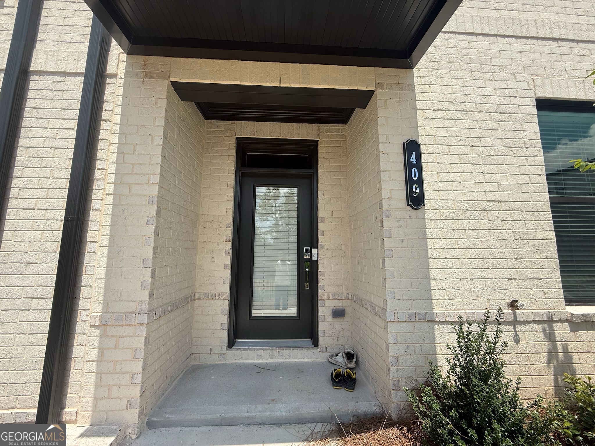 NEW Luxury Townhouse, situated in scenic Rhodes-Jordan Park in desirable Gwinnett County. Lake view from the window, watch games, steps away from home, and many more amenities offered by the city park and Downtown Lawrenceville. Complete List is attached in the Pictures, or you can search on Rhodes Jordan Park Website. The Auburn End UNIT, similar plan as offered in the Model home by the builder. The home is a Full 4 Bed and 3.5 Bath and a thoughtfully designed three-story townhome that feels spacious and inviting. Enter through the convenient alley-load 2-car garage and discover a basement-level bathroom and a fourth bedroom, and full bathroom, perfect for guests or a private home office. The second floor features an open concept living area that immediately feels like home. The casual gathering space seamlessly merges with the entertainer's kitchen, which boasts a seated island and ample cabinetry, creating the ideal setting for lively get-togethers or sophisticated dinner parties. modern linear fireplace, Lake view from the windows. Plenty of sunshine on the third level, a private owner's suite offers a tranquil retreat, complete with a spa-like bath and a generous walk-in closet, providing the luxury you deserve. Two additional bedrooms on this level ensure there's true space for everyone. All appliances included Fridge, Washer Dryer. Very convenient location Downtown Lawrenceville (5 mins), Within - 10-15 mins - The Exchange at Gwinnett shopping, dining, Top Golf, Andretti, Coolray Filed. Mall of Georgia, Costco, Sams Club etc. Highway 85, GA 316, HWY 20 **Model home Pictures are added to show the full potential with the furniture options & placement!