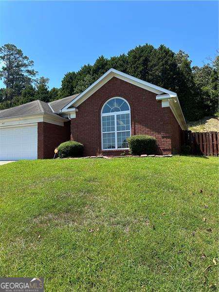 MOTIVATED SELLER! This is a stunning all brick home perfectly located in the River Rock Section with the comfort of 3 beds, 2 baths, an oversized Master Bedroom, an ensuite with whirlpool tub, double vanity, separate shower, two walk-in closets, light and airy cathedral ceilings in the living room area with a Free-standing fireplace. Beautiful hardwood flooring with wood-stained kitchen cabinets for those who enjoy the culinary arts. Brand new HVAC system (only 2 months old) a two-car attached garage with remote complete with Door opener. All conveniently located nearby Hospitals, grocery stores, schools, dining and Peachtree Mall. Come, enjoy and place your loving touches on this beautiful home ready to make it your own! THIS PROPERTY IS BEING SOLD "AS IS"