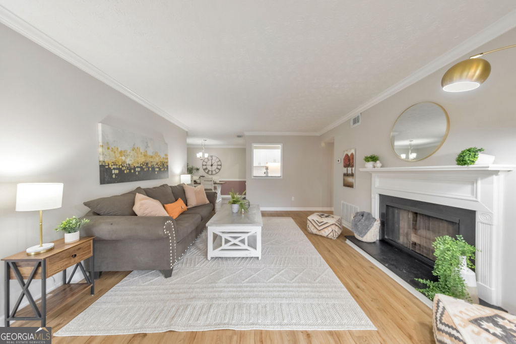 RARE FHA-APPROVED CONDO IN PRIME MARIETTA LOCATION! Hurry to snag this hard-to-find FHA-approved gem in the heart of Marietta-just minutes from I-75, I-285, SunTrust Park, Life University, KSU, shopping, the future IKEA, and vibrant downtown Atlanta! This immaculately renovated 2 bed/2ba first-floor unit has it all: new flooring throughout, newly updated bathrooms, fresh paint, stainless steel appliances, sleek granite countertops as well as a cozy fireplace for those quiet nights in. Sip your morning coffee in the sun-drenched sunroom or perhaps on the outdoor patio while enjoying some fresh air. This unit features 2 primary suites both with beautiful ensuites for privacy. Perfect for first-time buyers or savvy investors, this community has no rental restrictions and is extremely well-maintained with low HOA dues of just $254/month and strong reserves. Opportunities like this don't last-get in before prices rise and make this turnkey condo your new home or next investment win!