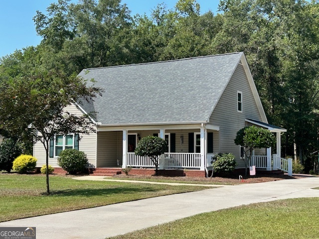 This home sits on 1.732 acres w/private back yard. This home features 3bedrooms 2.5 baths w/the master suite being downstairs. Master suite w/wood floors, walk-in closet, granite in bathroom, shower with seat. Family room w/wood floors & electric fireplace. Kitchen opens to dining area with undermount lights, oak cabinets, granite countertops, breakfast bar, all appliances stay, pantry, & extra storage under the stairs. Back foyer makes easy access to office w/ wood floors, built-in desk & bookshelves. Upstairs has 2 bedrooms 1 bath and a den area not to mention walk-in closets & attic access. Updated screened porch w/freshly painted floors w/access to brick patio. Concrete driveway w/circle drive & 20x24 new parking pad that is covered. 12x16 shop on concrete pad, electricity, & double doors for easy entry for lawn mower. Wooded lot that goes back to the creek. Covered front porch as well as separate siting area on side yard. New energy efficient windows. Water purification system