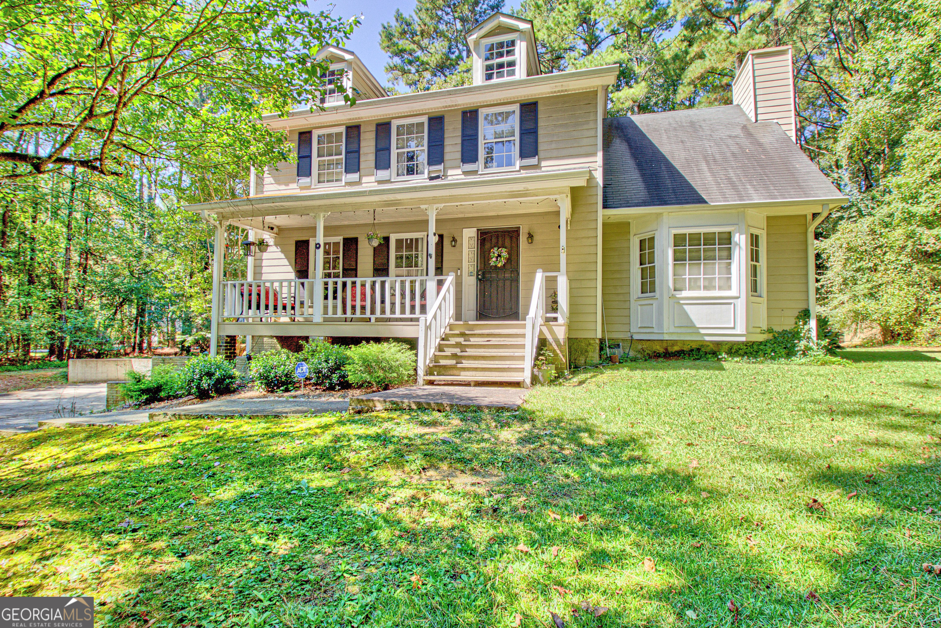 LOCATION, LOCATION, LOCATION! Welcome to this charming, spacious 4-bedroom, 2.5-bath home situated on a serene 1-acre lot with no HOA-offering freedom and flexibility rarely found in today's market. While this home is being sold As-Is, it presents a wonderful opportunity for buyers seeking space, privacy, and a prime location to personalize and update to their taste. Inside, you'll find a classic layout featuring real hardwood floors throughout living, dining, foyer and kitchen. The inviting living room and separate dining room offer ideal spaces for entertaining. The kitchen includes a cozy breakfast area and opens into a warm family room with a fireplace, perfect for relaxing evenings. Step out onto the back porch for additional living space and views of the peaceful backyard. A convenient powder room completes the main level. Upstairs, you'll find four generously sized bedrooms and two full baths. The primary suite features a soaking tub, separate shower, double vanities, and a skylight that fills the space with natural light. The basement includes one unfinished room with plumbing available, offering excellent potential for a future bathroom, additional living area, or storage. Additional highlights include: Tankless water heater, Two HVAC systems for enhanced climate control, Large 2-car garage with ample storage space.... This property is ideally located just minutes from Trilith Studios, Piedmont Fayette Hospital, Hartsfield-Jackson International Airport, and downtown Atlanta-making it a commuter's dream while still enjoying the peace of suburban living. Don't miss the opportunity to invest in a home with solid bones, a fantastic lot, and unlimited potential!