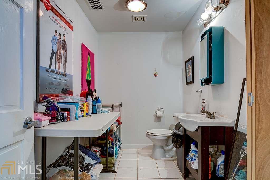 QUADRUPLEX Incredible income producing opportunity in Castleberry Hill! Four expansive loft-style residences including a street-facing unit with rolling doors for commercial possibilities. The sale will also include rear lot which is currently used for tenant parking. Walking distance to Mercedes Benz Stadium and all that Castleberry has to offer!