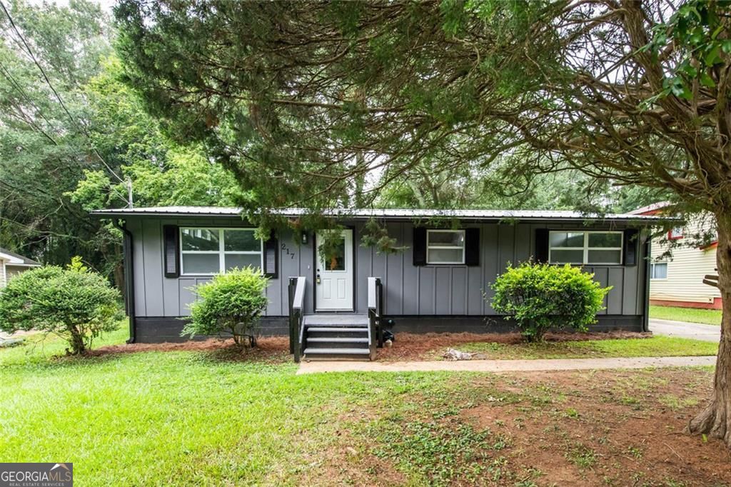 Charming house for sale in the city limits near Carrollton square. This updated home features new flooring, paint, HVAC, roof, kitchen cabinets, bathroom vanity, tile shower, granite through, and all new windows. With no HOA fees, tankless hot water heater, and a metal roof, this property offers both style and convenience for comfortable living.