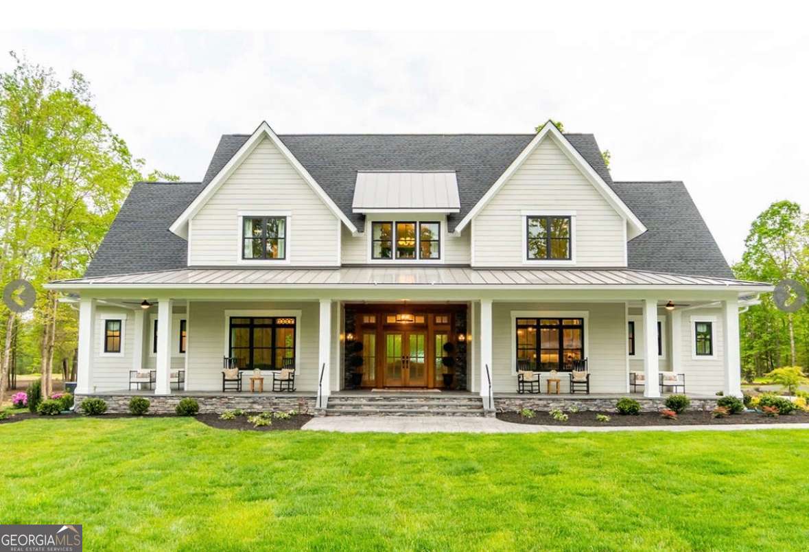 AMAZING custom Modern Farmhouse design in the established Sandy Creek golf course community in North Jackson County, close to Athens. Massive front porch leads to a mahogany double front door entry and open concept plan with living room open to the large gourmet custom kitchen with quartz counters, pot filler, large island, double ovens huge pantry and dining area. A private office space and large laundry room are close by but tucked away. The living space also offered wood style flooring and recessing crown molding lighting. Primary suite on main provides peace and quiet with a luxury bath offering a large tiled shower with rain shower & jets, bidet, and a separate stand-alone tub. The sprawling upper level provides a loft area, 2 bedrooms, 2 full baths, and 2 flex areas.