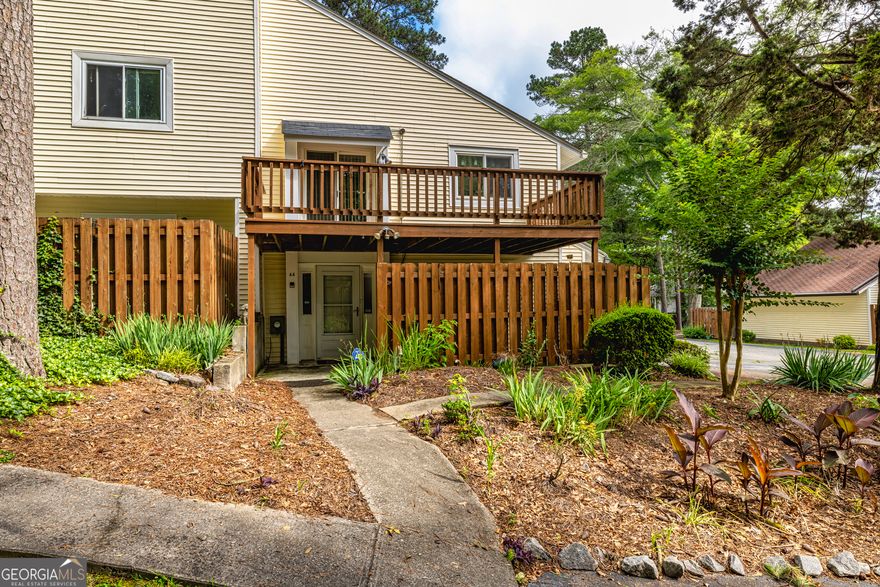 Discover comfort, convenience, and charm in this freshly painted end-unit condo, perfectly situated in Peachtree City. Keep your space organized in storage spaces of your attached garage located on the lower level. Unwind on the private deck just off the living/dining room and enjoy the comradery of other residents at the community pool.  You will find 2 bedrooms, 2 full baths, family/dining room, laundry closet and ample storage space off the kitchen. Conveniently located to tennis/pickle ball courts, shopping, golf cart paths, Lake Peachtree, Trilith, Fayette/Newnan Medical Facilities, PTC Library, Drake Field Night Market and so much more.  HOA fees cover water, trash pickup, common area upkeep, termite bond and fire insurance. Furniture in condo is included. Staging accessories are not included.