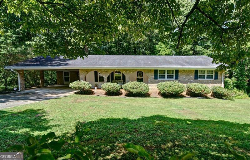 Don't miss the chance at this affordably charming all brick ranch home sitting on a huge corner lot that offers the ideal setup for both comfortable living and maybe even running your personal business from. With plenty of parking and yard space, a fantastic layout, and an unbeatable convenient location, this property is a rare find! Step inside to a gorgeous family room featuring a cozy fireplace, a bright sun porch, and a screened-in deck perfect for year-round enjoyment. The spacious kitchen flows into a welcoming dining room, ideal for hosting. The main level includes 3 generously sized bedrooms, while the large finished basement with outdoor access provides even more space-perfect for a home office, business area, multi-family use, or entertainment suite. Outside, enjoy a beautiful fenced backyard, offering privacy and room to relax or expand. Too good to be true at this price-don't miss your chance to own this versatile gem!