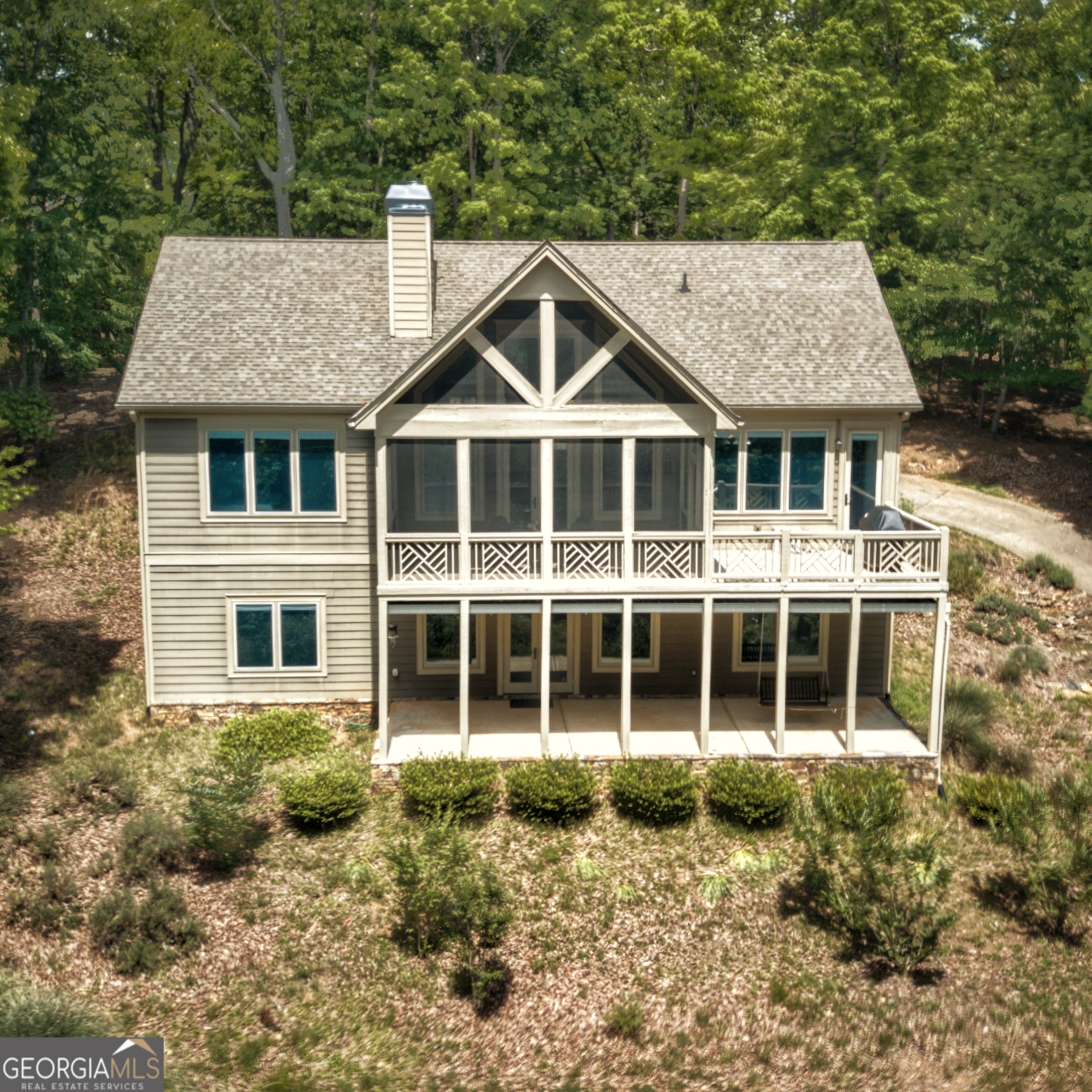 LAKE VIEW home upscale in every detail and built with the highest level of energy efficiency. This home is year round perfection built on a large double lot with level drive from the gate and near all amenities. Comfortable living invites from the stone front porch graced w/ custom plantation shutters into expansive Pella windows w/ screens and internal shades throughout. Wood grain cathedral ceilings add the perfect amount of warmth and wood without being too woodsy! Trim moulding defines the sleek lines throughout this spacious home. Everything in the Gourmet kitchen is upscale including the granite countertops, beautiful cabinetry w/ convenient inserts and modern soft close drawers and large pantry. There is room to invite guest to relax around the kitchen bar and great room w/ open concept dining. The Exquisite Master is on the Main with beautiful trey ceilings and luxurious master bath w/ decorative tiled steam shower. Not one but two Rinnai tankless water heaters. Downstairs features family room w/ bar, surround sound and plenty of room for your pool table flanked w/ two bedroom suites for ultimate guest experience. Still there is room for exercise space or workshop, wine and storm cellar reinforced w/ 16 inches of concrete. Stay warm during inclement weather with instant on generator. Parking is so convenient! Delivery trucks love the big turnaround at parking area that will accommodate 6+ vehicles. The attached 3 car garage includes golf cart parking and storage space above. 100% day one termite Sentricon protection. Escape to North Georgia and to the beginning of the Appalachian Trail and still be w/in hour of Atlanta. Bent Tree is one of the only golf cart friendly communities in North Georgia ~ also debt free and high quality water system. Amenities include Joe Lee designed challenging 18 Hole golf course and driving range, Two swimming pools, Indoor/Outdoor tennis courts include clay courts and pickle ball courts, 110 acre lake surrounded by beautiful mountain views is 80 feet depth and so inviting for fishing, kayaking, paddle board and swimming at the beach! Club Tamarack or the Tavern at the 19th Hole offers chef prepared meals and casual breakfast, lunch, and dinner not to mention karaoke, and trivia just to name a couple of fun clubs! Upgrade your quality of life with this exquisitely comfortable executive home w/ lake view on one of the best and most convenient streets in Bent Tree!