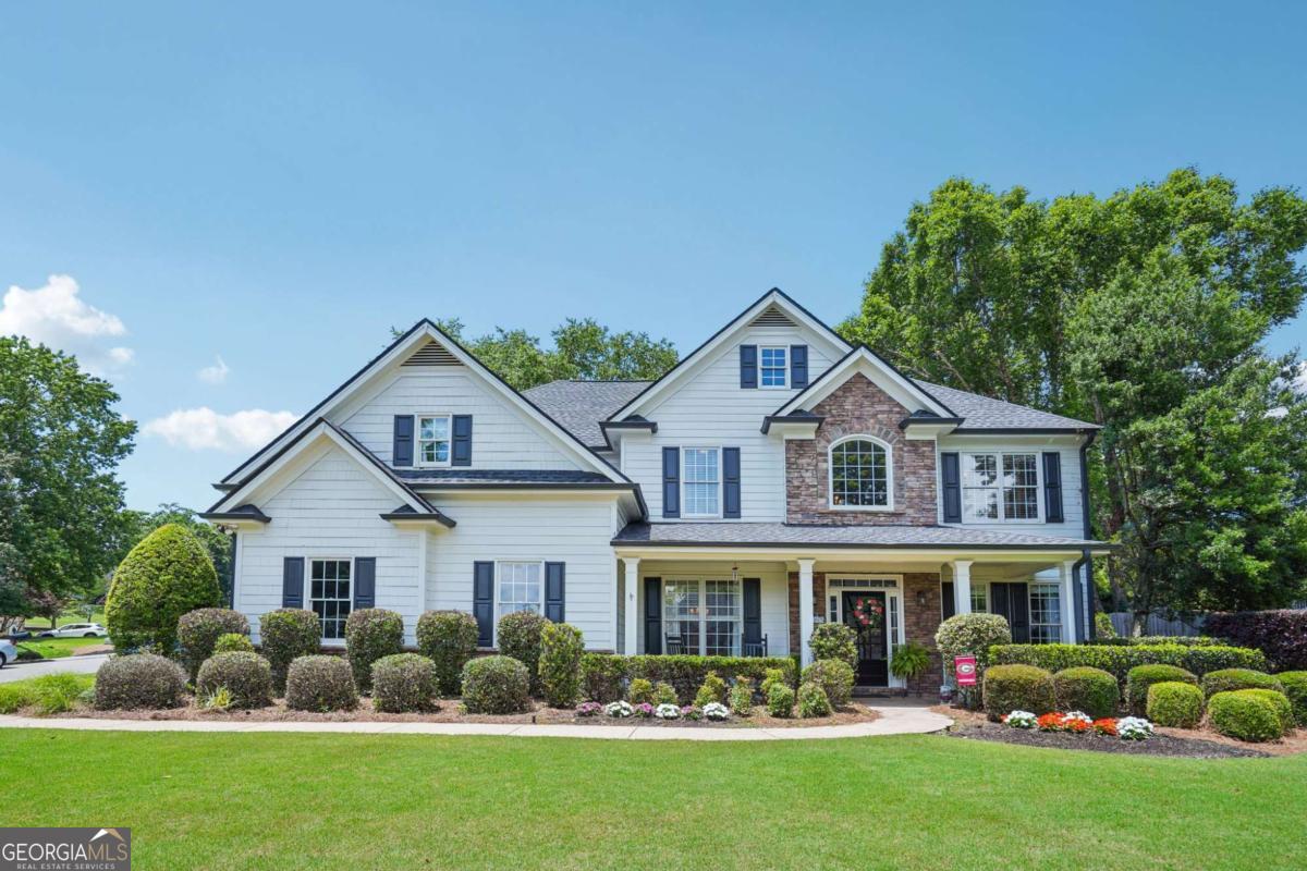 Welcome to this beautifully maintained home in the heart of highly sought-after Three Chimneys Farm! Situated on a prime lot with incredible curb appeal, this home features a spacious front yard perfect for neighborhood football games and an inviting front porch for relaxing and socializing. The main level includes a private office, a guest bedroom with full bath, formal dining room, and an open kitchen ready for everyday living and entertaining. Step outside to the walk-out patio and enjoy the private backyard - ideal for hosting friends and family. Upstairs, the oversized primary suite boasts a cozy sitting area and a bonus room off the walk-in closet - perfect as a nursery, home office, workout space, or craft room. Three additional bedrooms complete the upper level - one with a private en-suite bath and the other share a hall bathroom. Located in a vibrant swim/tennis community and zoned for top-rated Forsyth County schools. This home has the flexibility, warmth, and charm you've been looking for. Don't miss your chance - homes in Three Chimneys move fast!