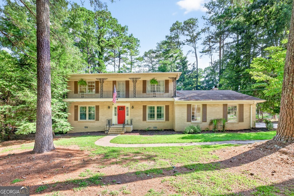Welcome home to this beautiful, 2 story four side brick vintage home in East Athens with NO HOA and 4 miles from UGA campus. With NO HOA restrictions, this home if perfect if you have a UGA student looking for housing off campus. This stunning home, built in 1968 still boast some amazing features from the 1968 build including the original tile in two of the bathrooms. This home features not one but two family rooms. One of which that has a beautiful fireplace and leads out to the covered back porch with a private, fenced in back yard that is perfect for entertaining. The main level features one bedroom and also a full bathroom for your guest. Upstairs you will find three bedrooms, including the primary bedroom that has access to the second level balcony.