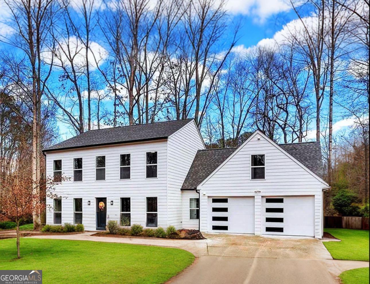 This beautifully renovated home is truly a must-see! As you step inside, you'll immediately be captivated by the open layout, flooded with natural light. Every detail has been carefully considered, with updates including a new roof, new siding, fresh baseboards, stylish new fixtures, high-end appliances, and gorgeous flooring throughout. Both bathrooms have been fully renovated with top-of-the-line materials, creating a spa-like feel in each space. You'll also notice the fresh, professionally selected paint colors, new bathroom tiles, elegant glass doors, new doorknobs, and brand-new doors and toilets. The new carpet adds warmth and comfort to the living areas. This home is not just about the inside; the outside features a spacious yard, perfect for creating lasting memories. The neighborhood is desirable, surrounded by lush trees and nature, offering a peaceful and tranquil atmosphere. Plus, it's conveniently located near everything you need. One of the standout features of this home is the spacious two-car garage, adding extra convenience. What we love most is how the renovations have transformed this property into something that feels brand new, offering you peace of mind for years to come. Don't miss the chance to see this home in person-schedule your appointment today and experience all it has to offer!