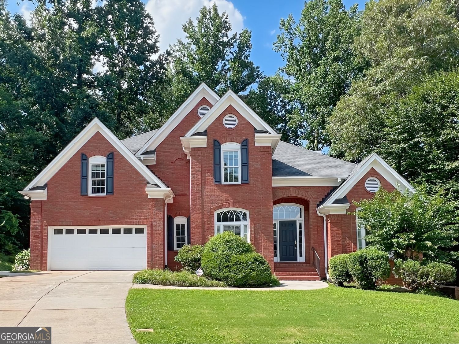 Welcome to 1735 Saint Julian Street in the highly sought-after Suwanee, GA community. This spacious 5-bedroom, 3-bathroom home offers a bright and open floor plan with brand-new hardwood floors throughout. The main level features a guest bedroom with a full bath, a convenient laundry room, and multiple living areas including a formal living room and a separate dining room. The large open kitchen is a chef's dream, boasting granite countertops, ample cabinetry, stainless steel appliances, and a sunny breakfast nook overlooking the private backyard. Step outside to a generous deck-perfect for entertaining or enjoying quiet evenings. Upstairs, the oversized Owner's Suite offers a true retreat with a spa-like bathroom that includes a soaking tub, separate shower, double vanities, and a large walk-in closet. Two additional upstairs bedrooms are both generously sized and share a well-appointed full bathroom with separate vanity areas for added convenience. A partially finished basement provides flexible space for a home office, gym, or bonus room. This home also features a private backyard, ideal for outdoor activities and relaxation. Don't miss the chance to lease this beautiful, well-maintained home in a desirable Suwanee neighborhood!