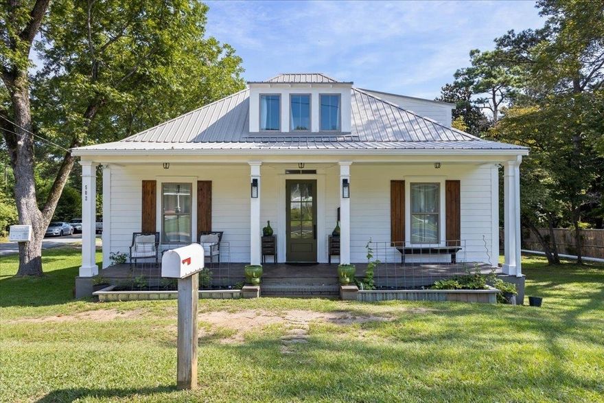 Beautifully renovated 4 bedroom 2 1/2 bathroom home with 2200 square feet of living space. This home is a must see. On main level are 3 bedrooms with a jack and jill bathroom with soaker tub as well as a half bath and walk in closet. The inviting open concept kitchen and living room are perfect to prepare meals and spend time with friends and family. Up the stairs is an 800 square foot loft with full bathroom. The back porch with privacy curtain is great for winding down after a long day. Out back a 36'x40' drive through detached garage has an unfinished 700 sq ft apartment on upper level and 2 economy rooms on lower. Both need sheetrock and paint to get your residual income flowing. Located 1/2 mile from Gordon College and 1/2 mile from the downtown square. Call Jennifer with any questions 404-392-9668.