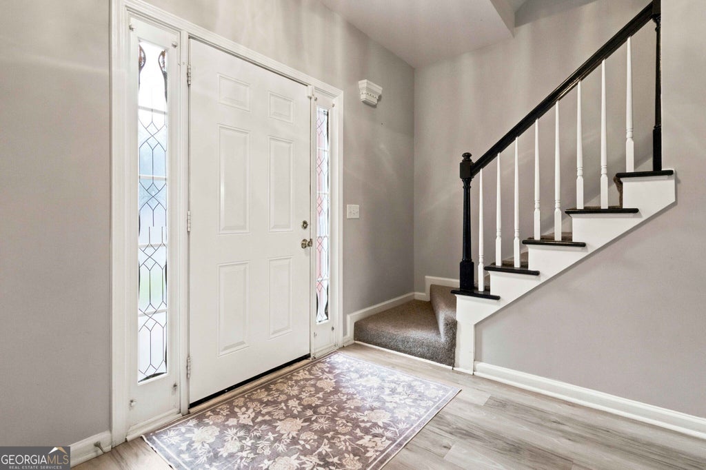 Photo of 5585 Martin Grove Drive NW, Lilburn, GA 30047 (MLS # 10839591)